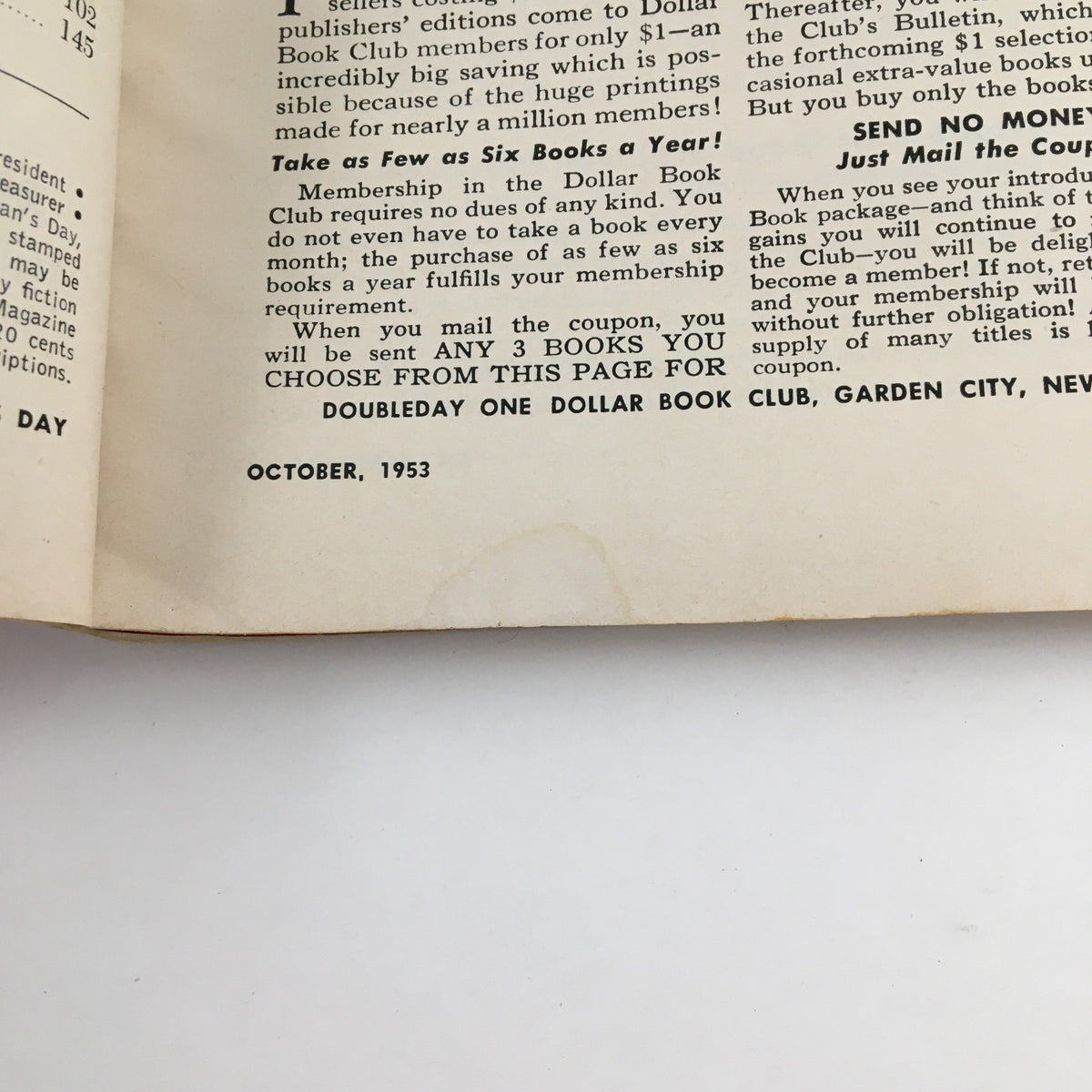 Interior page of Woman's Day Magazine October 1953, featuring a vintage advertisement for the Dollar Book Club, showcasing book purchasing options with details related to membership and offerings.