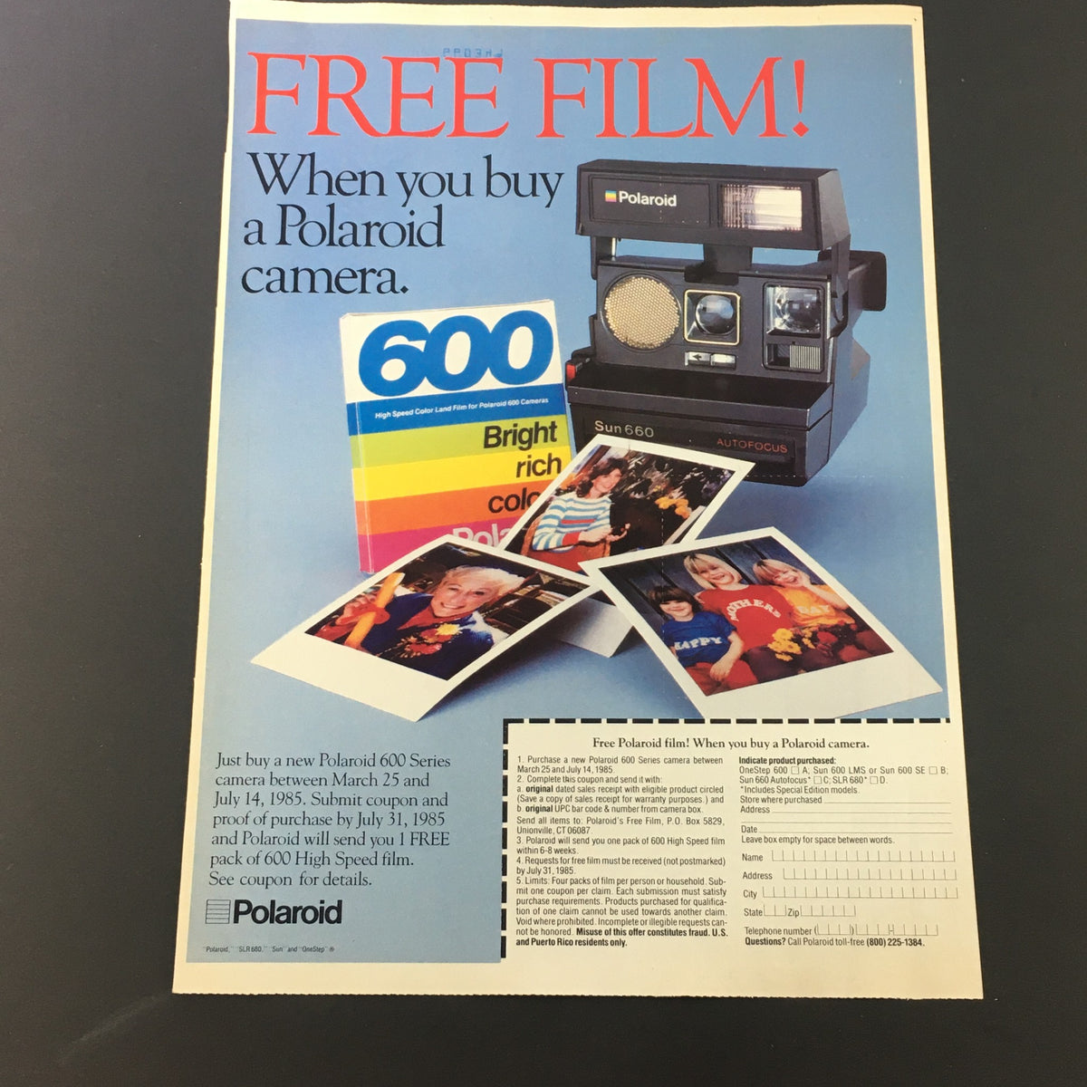 Vintage 1985 Polaroid camera advertisement offering free film with the purchase of a new Polaroid 600 Series camera, displaying the Sun 660 model and photos taken with it.