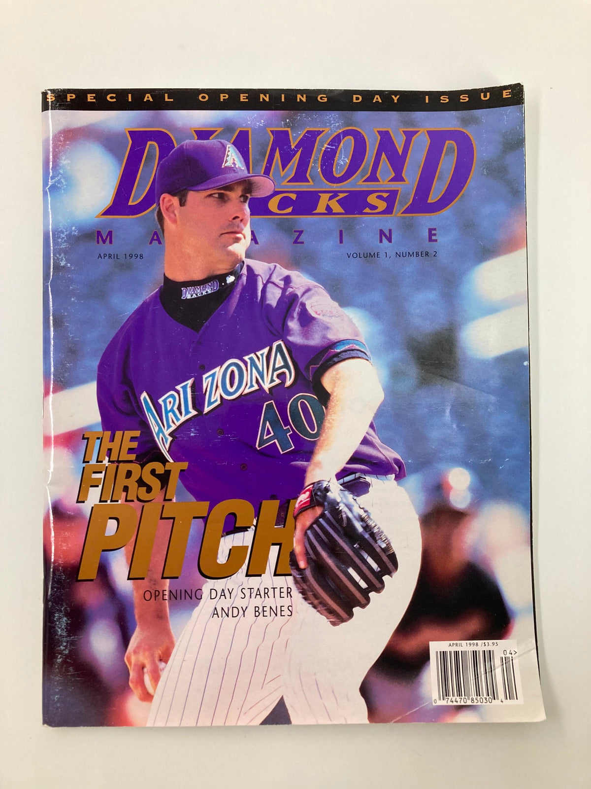 Cover of Diamondbacks Magazine April 1998 Vol 1 #2 featuring Andy Benes as the opening day starter, showcasing the title 'The First Pitch' and vibrant graphics commemorating the team's inaugural season.