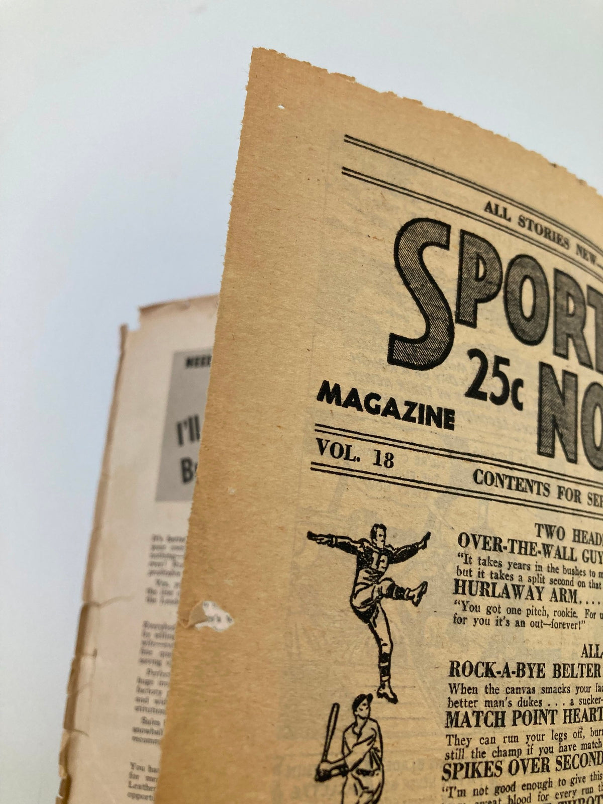 Close-up of the cover edge of VTG Sports Novel Magazine September 1949 Vol 18 #2 featuring an illustration of an athlete. Shows signs of age with wear on the cover.