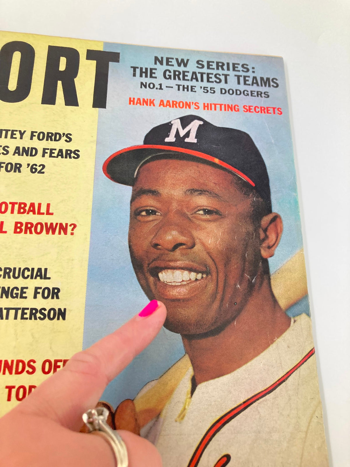 Close-up of the VTG Sport Magazine June 1962 cover highlighting Hank Aaron's smiling face, emphasizing the vintage appeal and significance of this baseball publication.