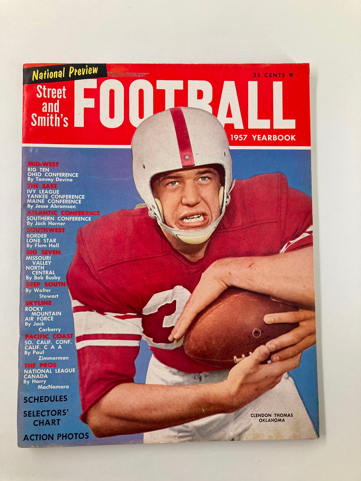 Street & Smith's Football 1957 Yearbook featuring Clendon Thomas from Oklahoma on the cover, highlighting the mid-20th century college football culture.