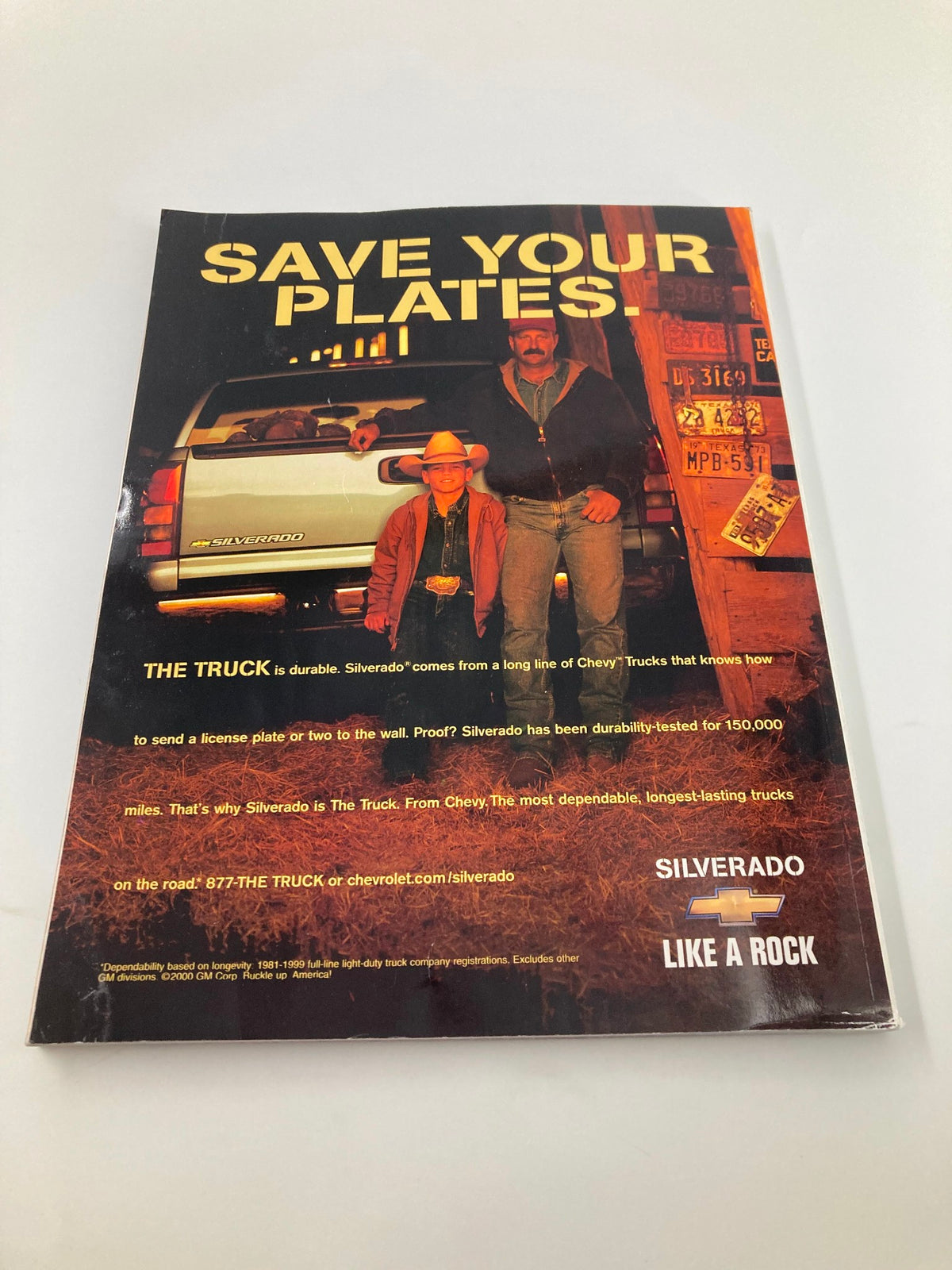 Advertisement for Chevrolet Silverado included in the 2000 Major League Baseball All Star Game Official Program, emphasizing durability and reliability.