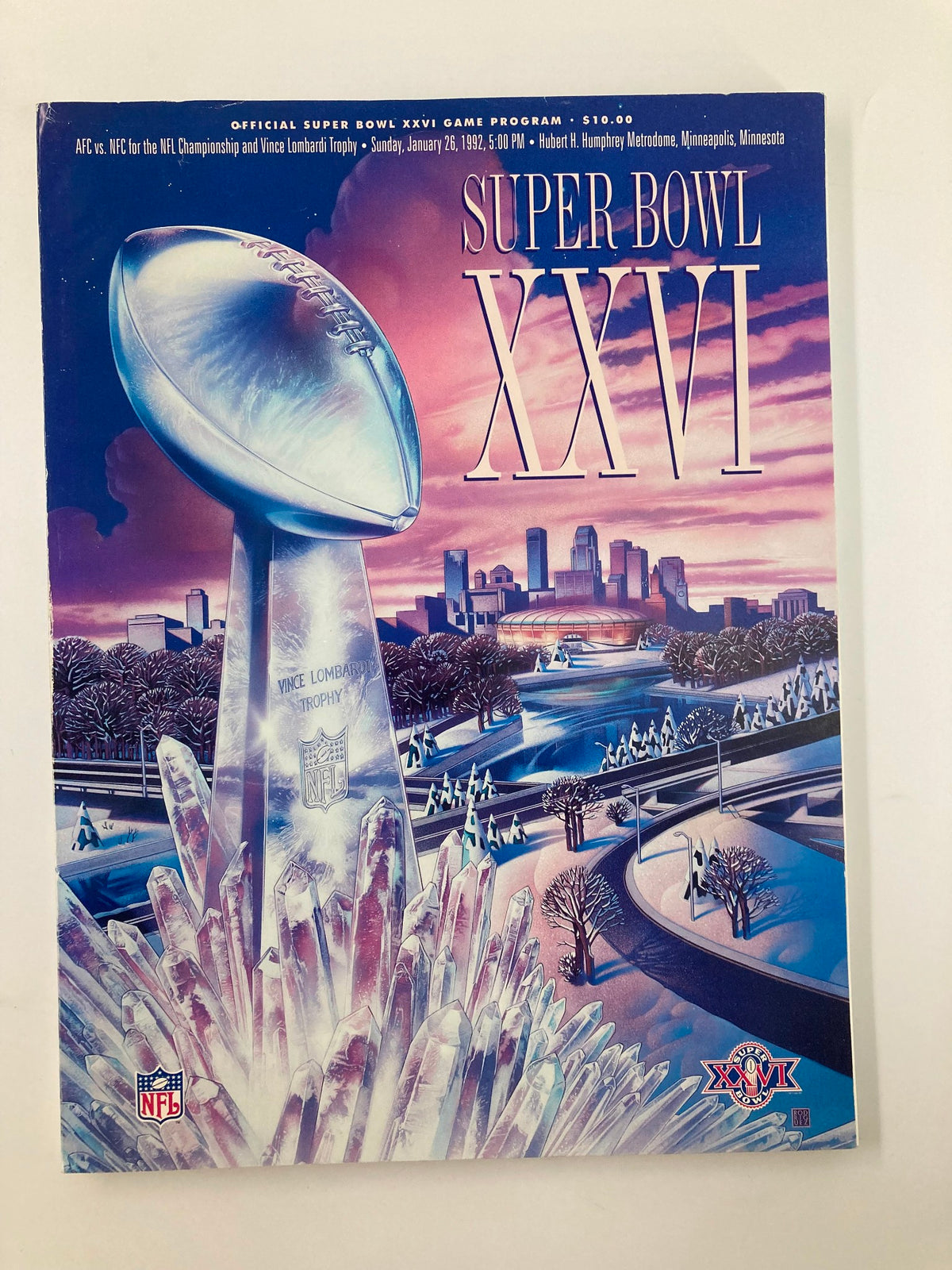 Cover of the January 26 1992 NFL Official Super Bowl XXVI Game Program featuring a visual of the Vince Lombardi Trophy and a wintery Minneapolis landscape.