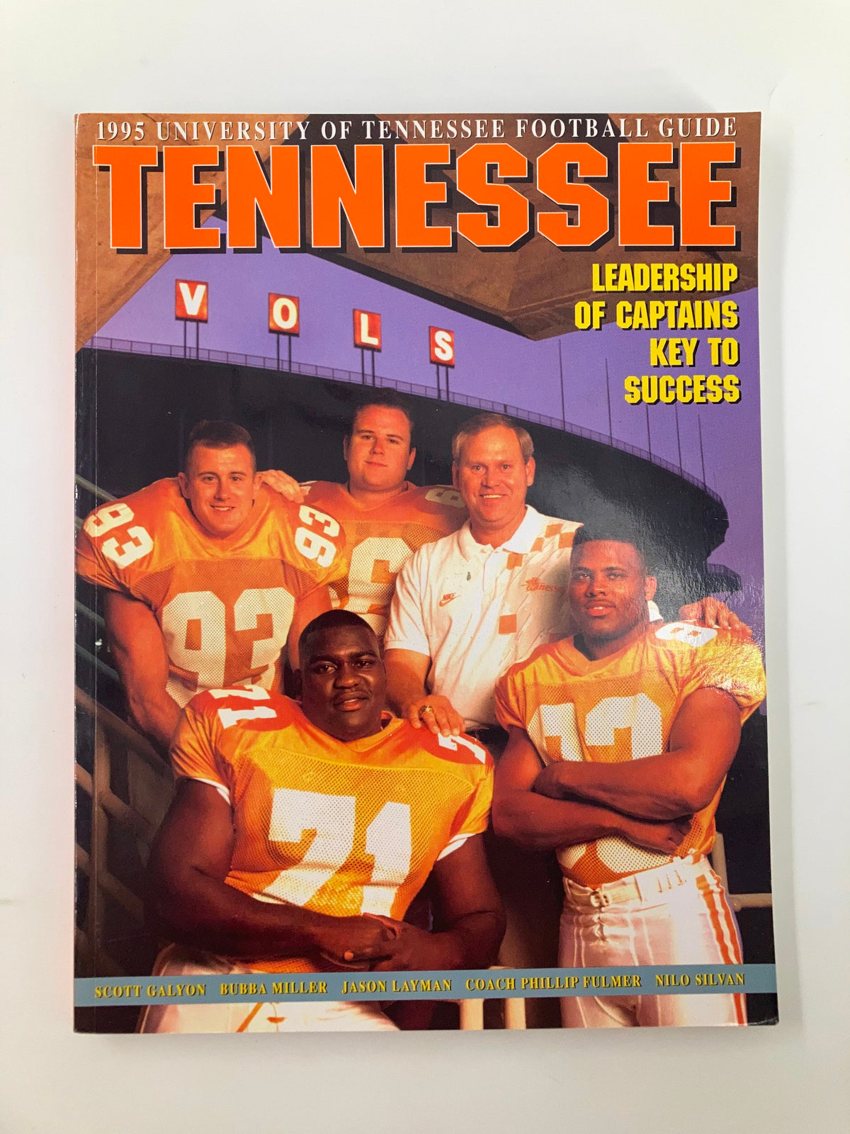 1995 University of Tennessee Football Guide cover featuring Coach Phillip Fulmer with team captains Scott Galyon, Bubba Miller, Jason Layman, and Nilo Silvan. The cover highlights the leadership theme and showcases the Tennessee Volunteers branding.