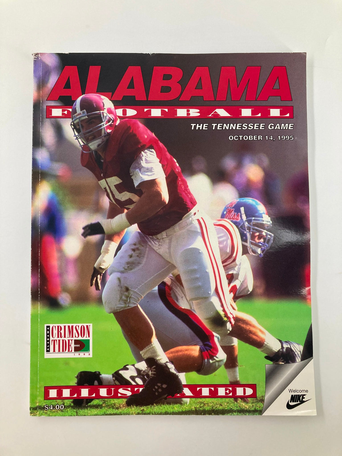 Official souvenir program for the October 14, 1995 Tennessee Game featuring Alabama football, showcasing a dynamic image of a player in action with the Crimson Tide branding.