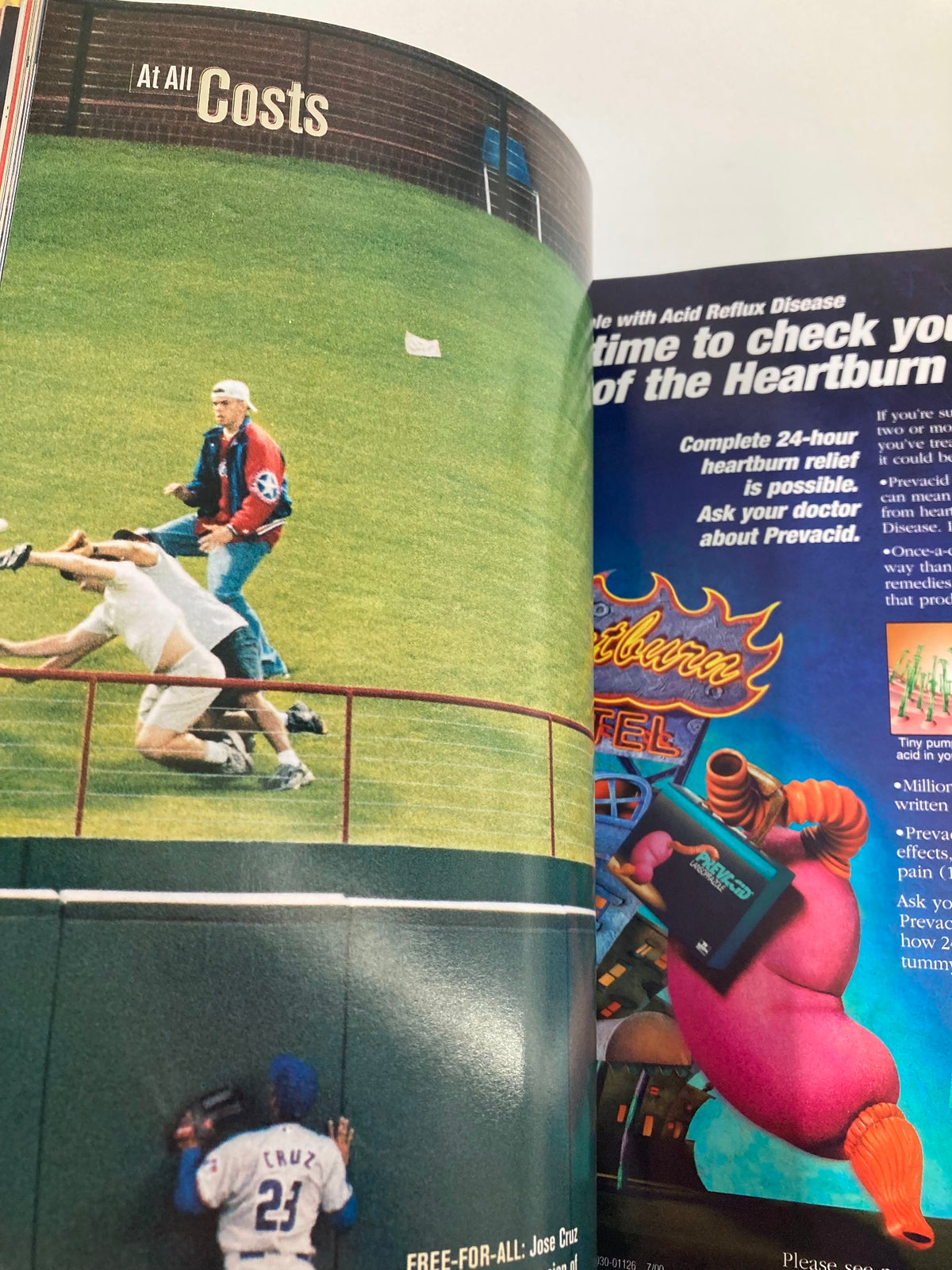 2000 Major League Basketball All Star Game Official Program showcasing players in a dramatic moment during the all-star action.