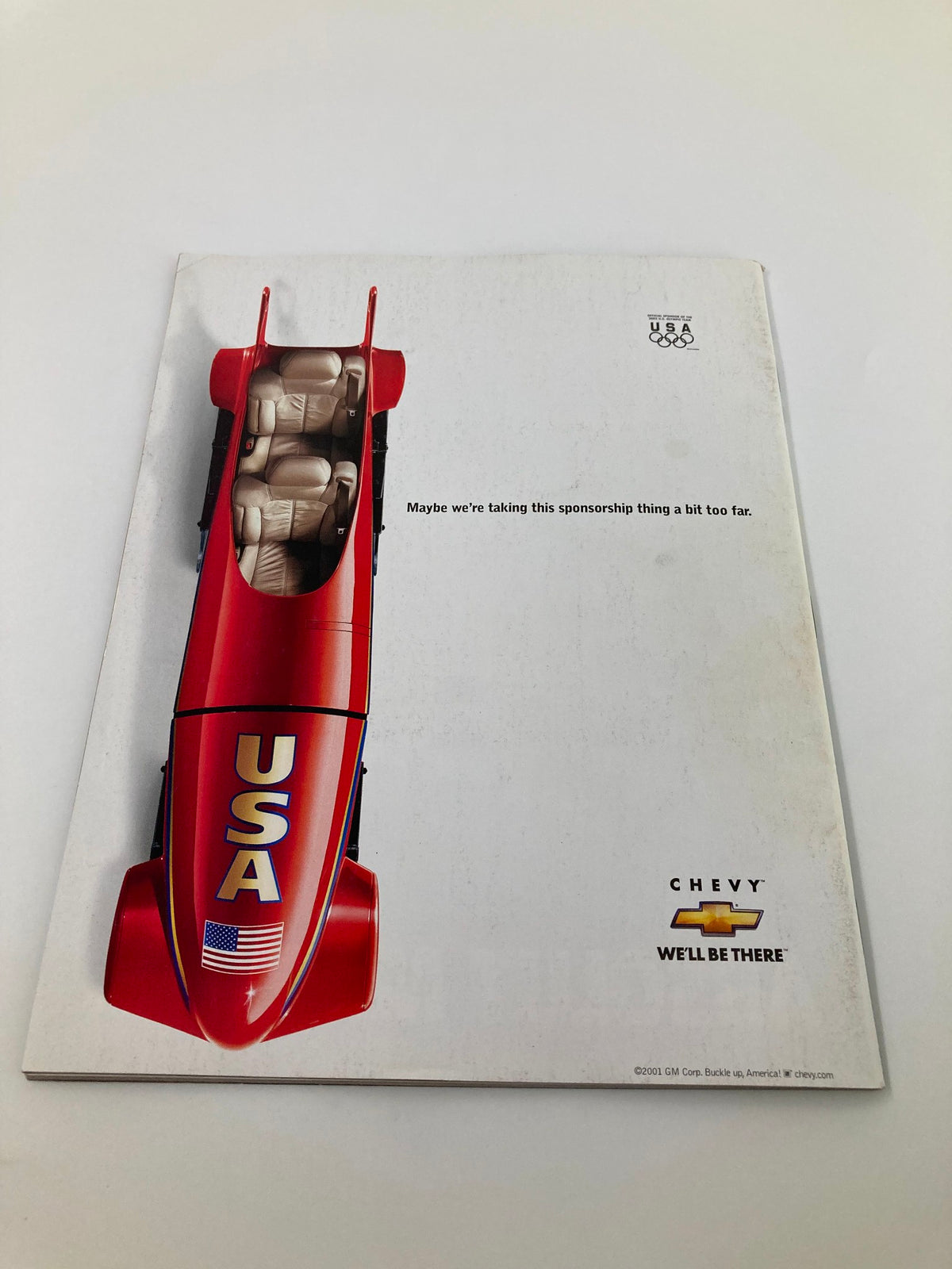 Back cover of the Sports Illustrated Magazine August 18, 2002, featuring a humorous Chevrolet advertisement related to the USA Olympic team sponsorship.