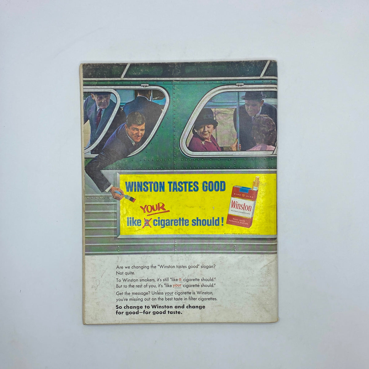 Back cover of Playboy Magazine August 1966 featuring an advertisement for Winston cigarettes. The ad shows various individuals looking out from a bus, promoting the slogan 'Winston tastes good like your cigarette should!' This vintage magazine cover is significant for collectors.