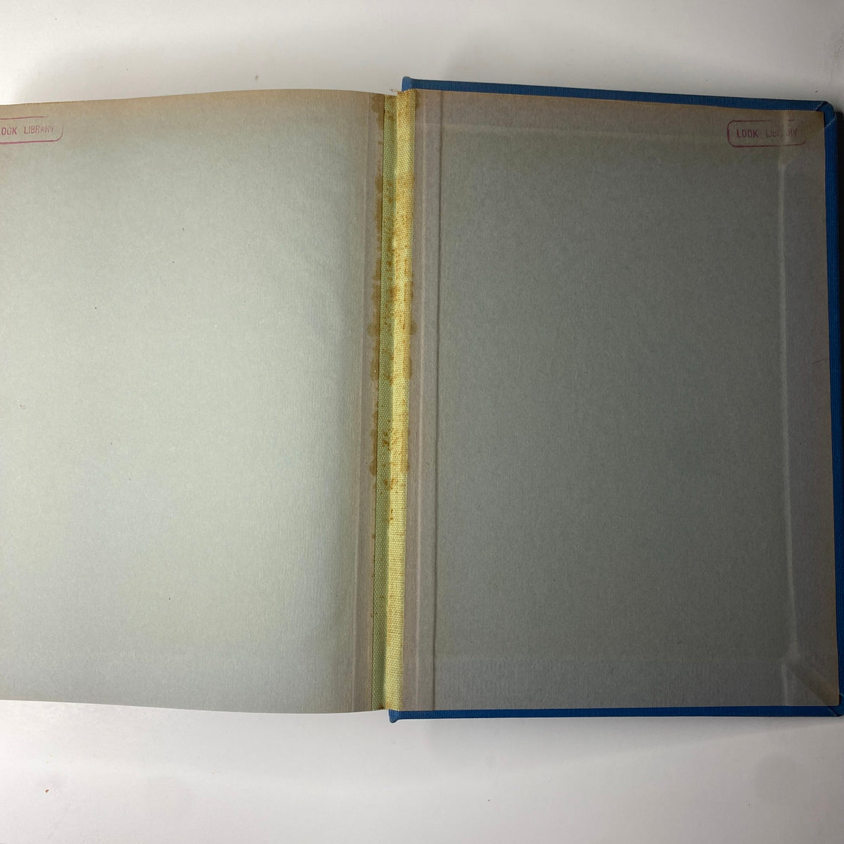 Interior of 'Time Magazine Library Bound Weekly April 3, 1944 - June 26, 1944', showcasing the first page with a library sticker, indicating its history and condition.