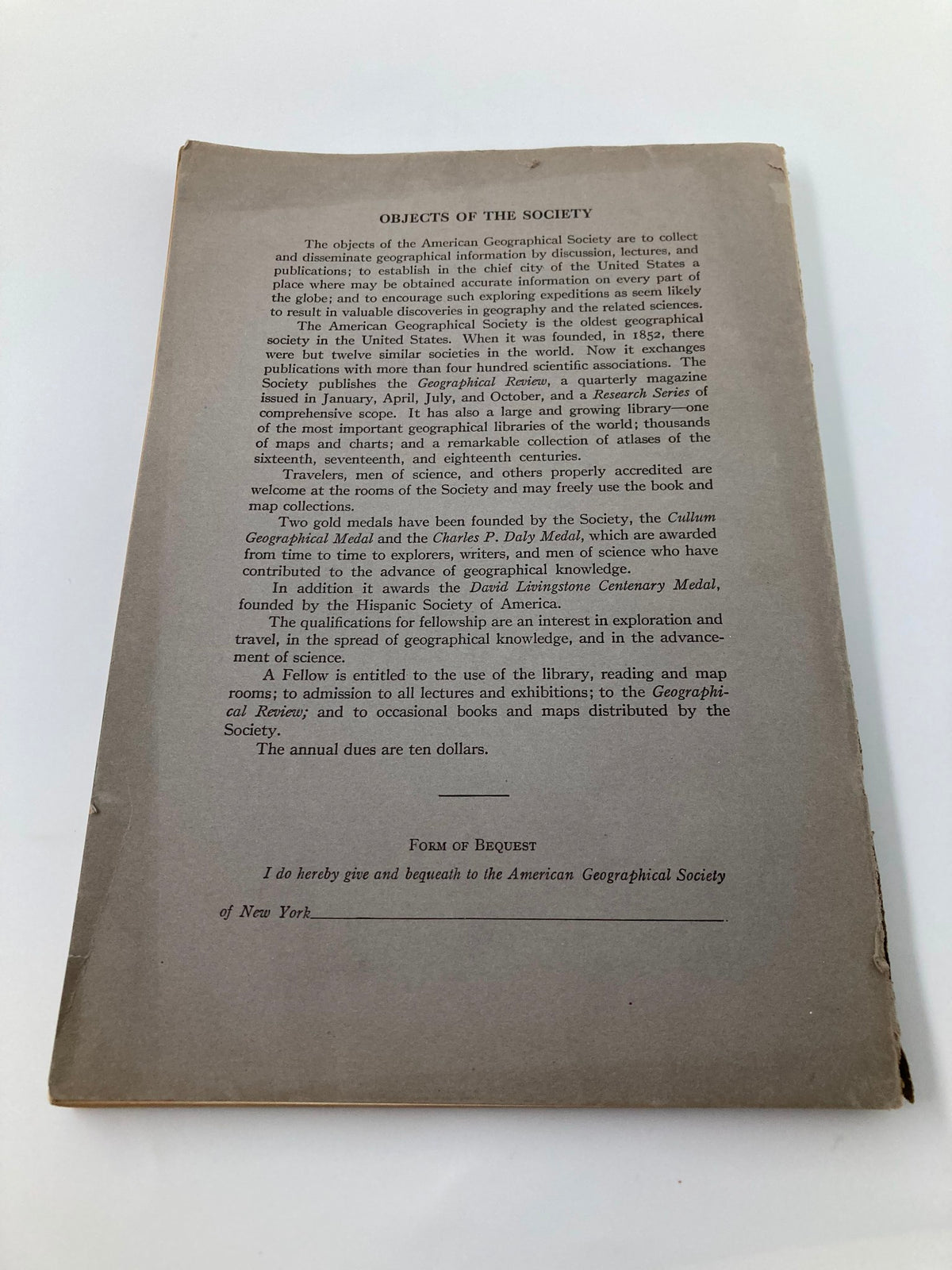 Back cover of the Geographical Review 1922, outlining the objectives of the American Geographical Society of New York and its contributions to geography.