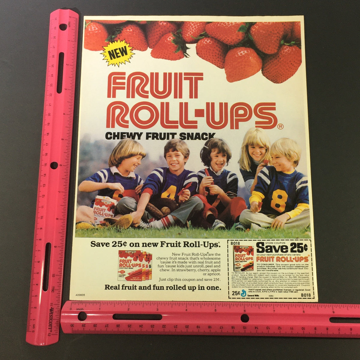 VTG Retro 1983 Fruit Roll-Ups Chewy Fruit Snack Print Ad featuring children enjoying the snack, with promotional offer details and vibrant imagery of strawberries, designed for nostalgia and collectible appeal.