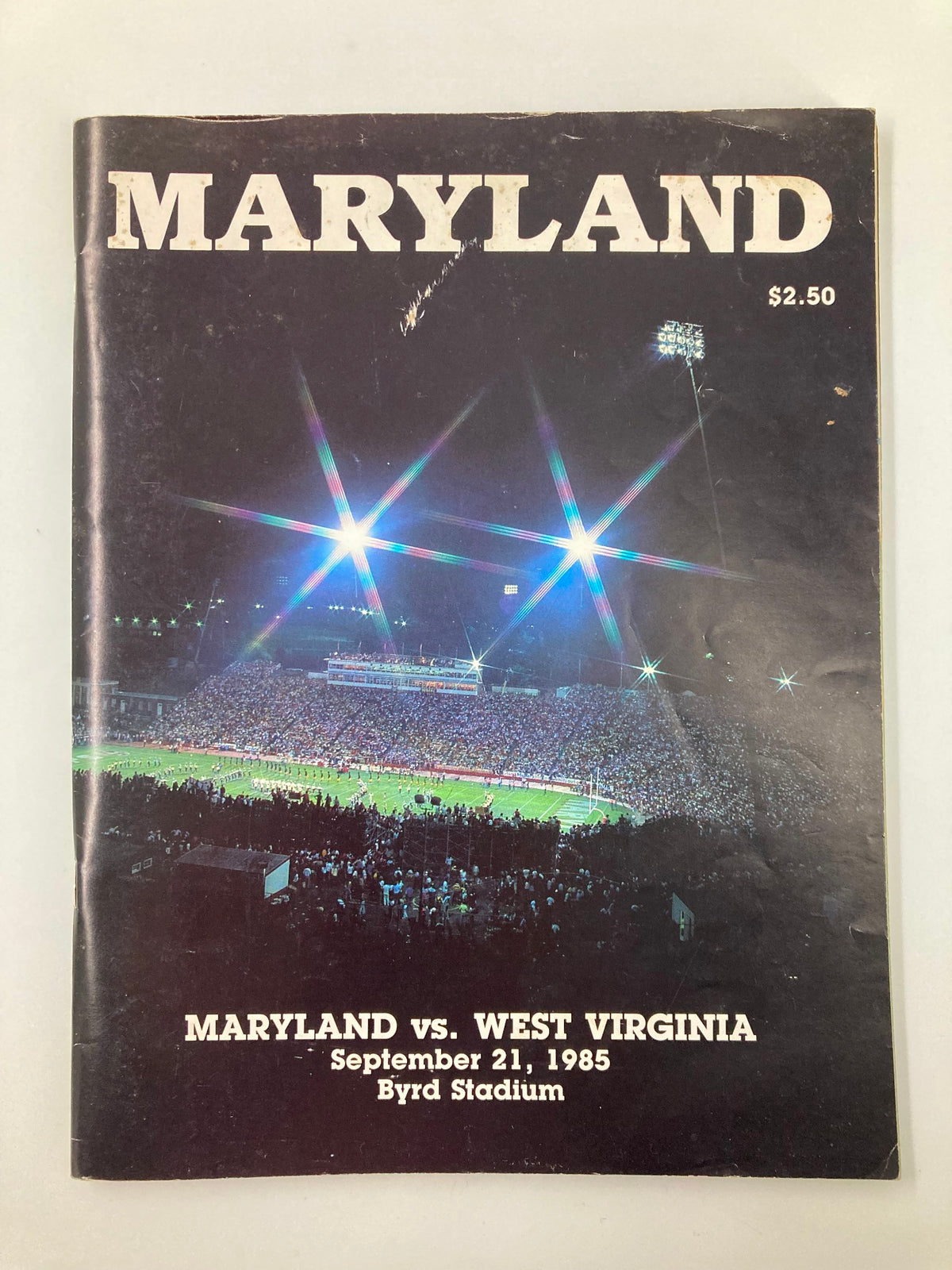 Cover of the September 21, 1985 College Football Maryland vs West Virginia Official Program, featuring a nighttime stadium scene and the title 'MARYLAND' prominently displayed.