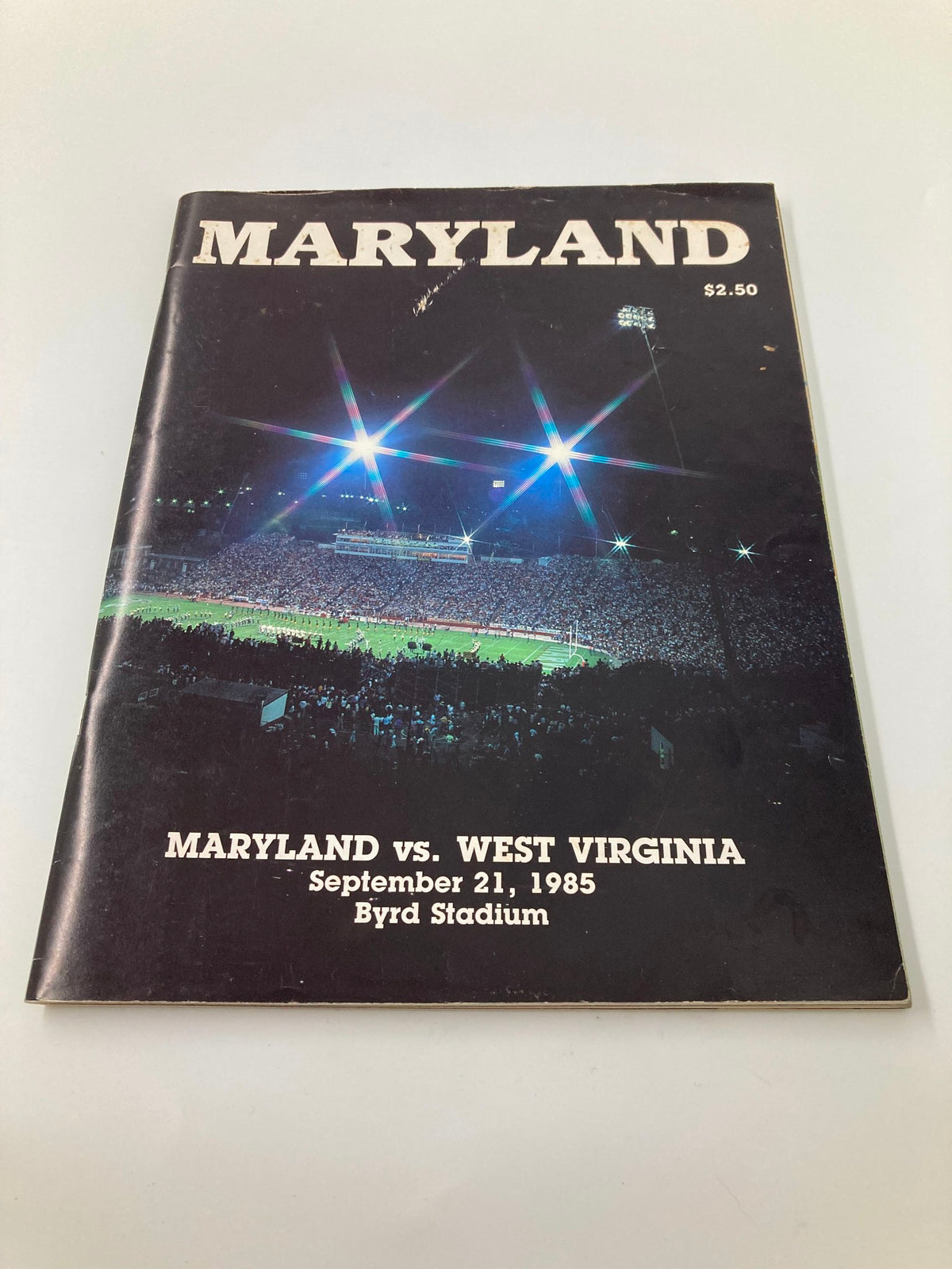 Alternate view of the September 21, 1985 College Football Maryland vs West Virginia Official Program, showcasing the nighttime atmosphere at Byrd Stadium.