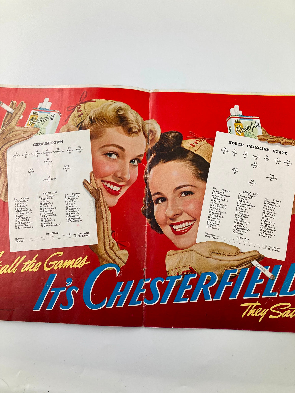 November 15 1941 College Football Georgetown vs North Carolina State Program featuring a vintage advertisement with two women and the game schedules for Georgetown and North Carolina State.