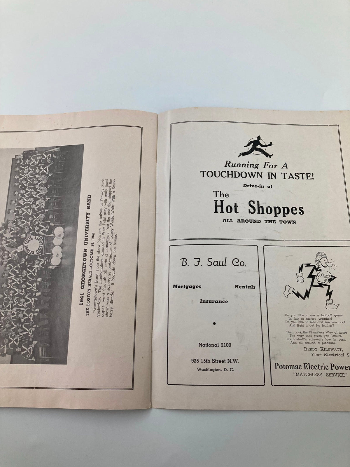 Inside page of the November 15 1941 College Football Georgetown vs North Carolina State Program featuring advertisements and team details.