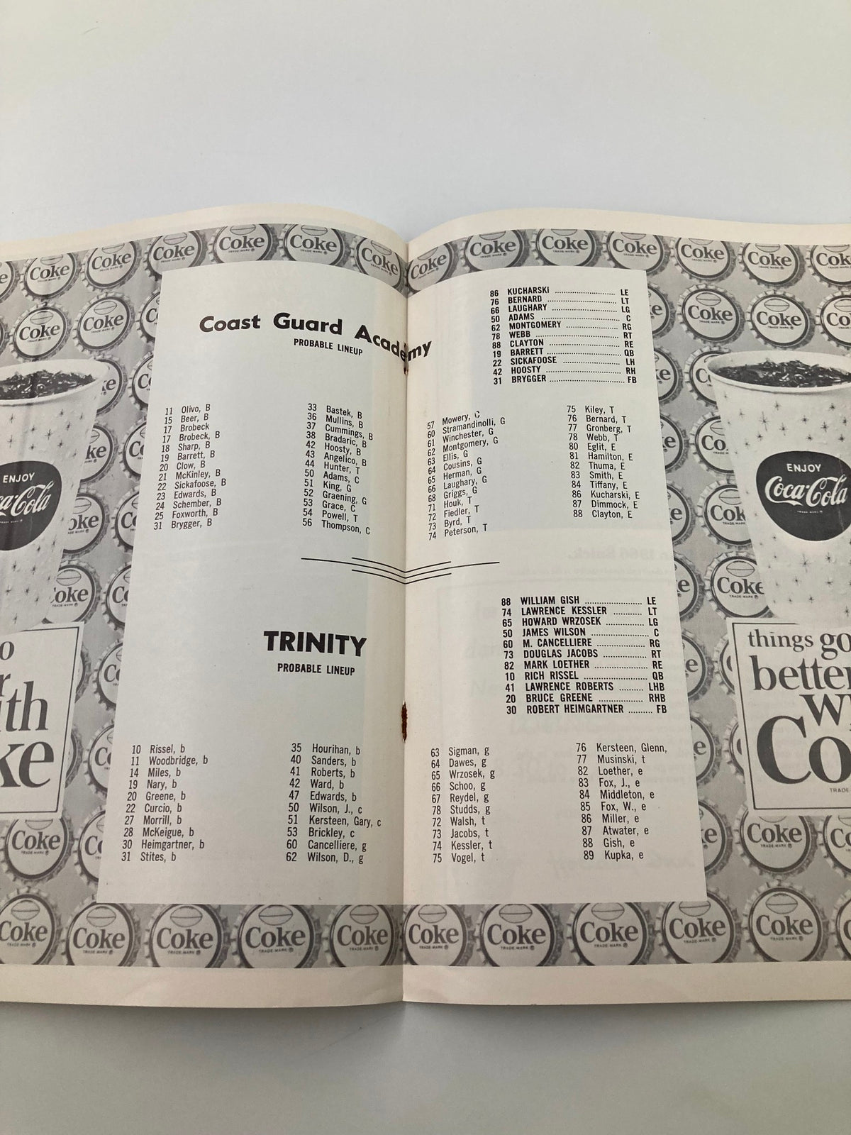 Probable lineups for Coast Guard Academy and Trinity in the October 30, 1965 NCAA Football program, displayed with advertisements.