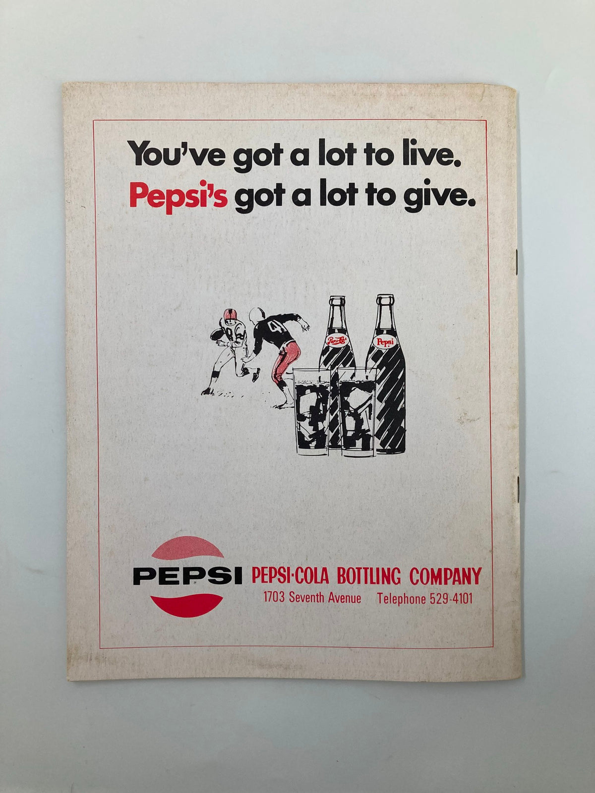 Back cover of the Official Souvenir Program Booklet for October 31, 1970, featuring a Pepsi advertisement with football imagery.