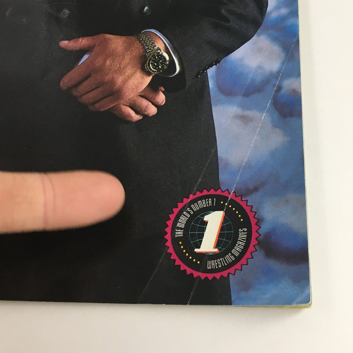 Close-up of the WWF Wrestling Spotlight Magazine 1993 Vol 19 featuring Curt Hennig, showing his hands and a badge stating 'The World's Number 1 Wrestling Magazine'.