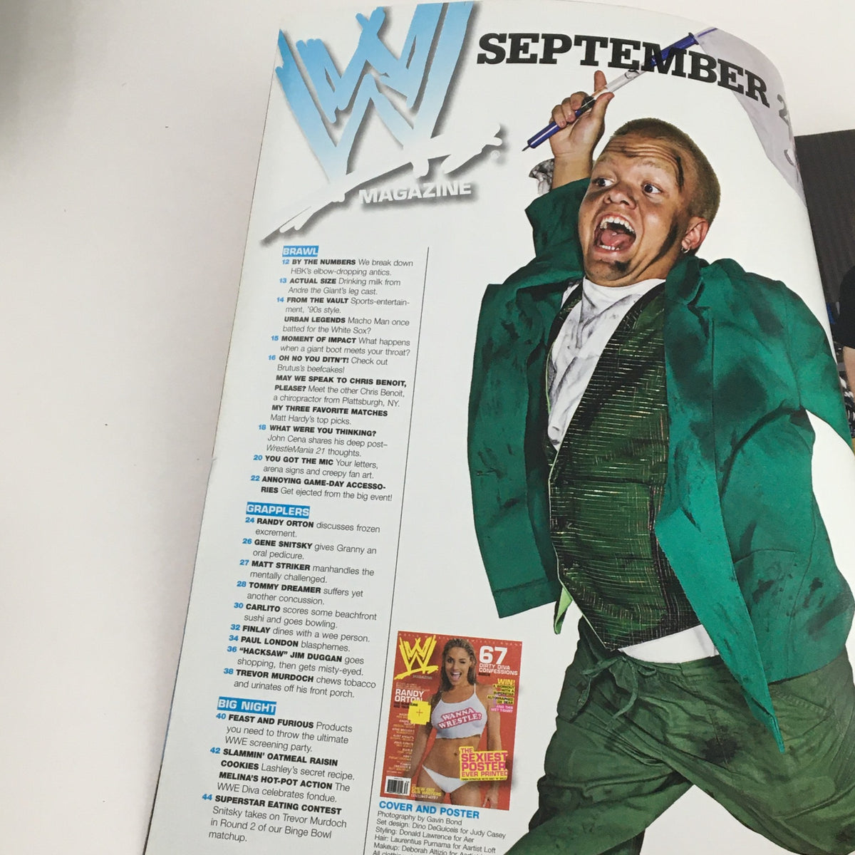 Inside page of WWE Magazine September 2006, featuring an article overview and images, showcasing the vibrant wrestling culture and notable personalities.