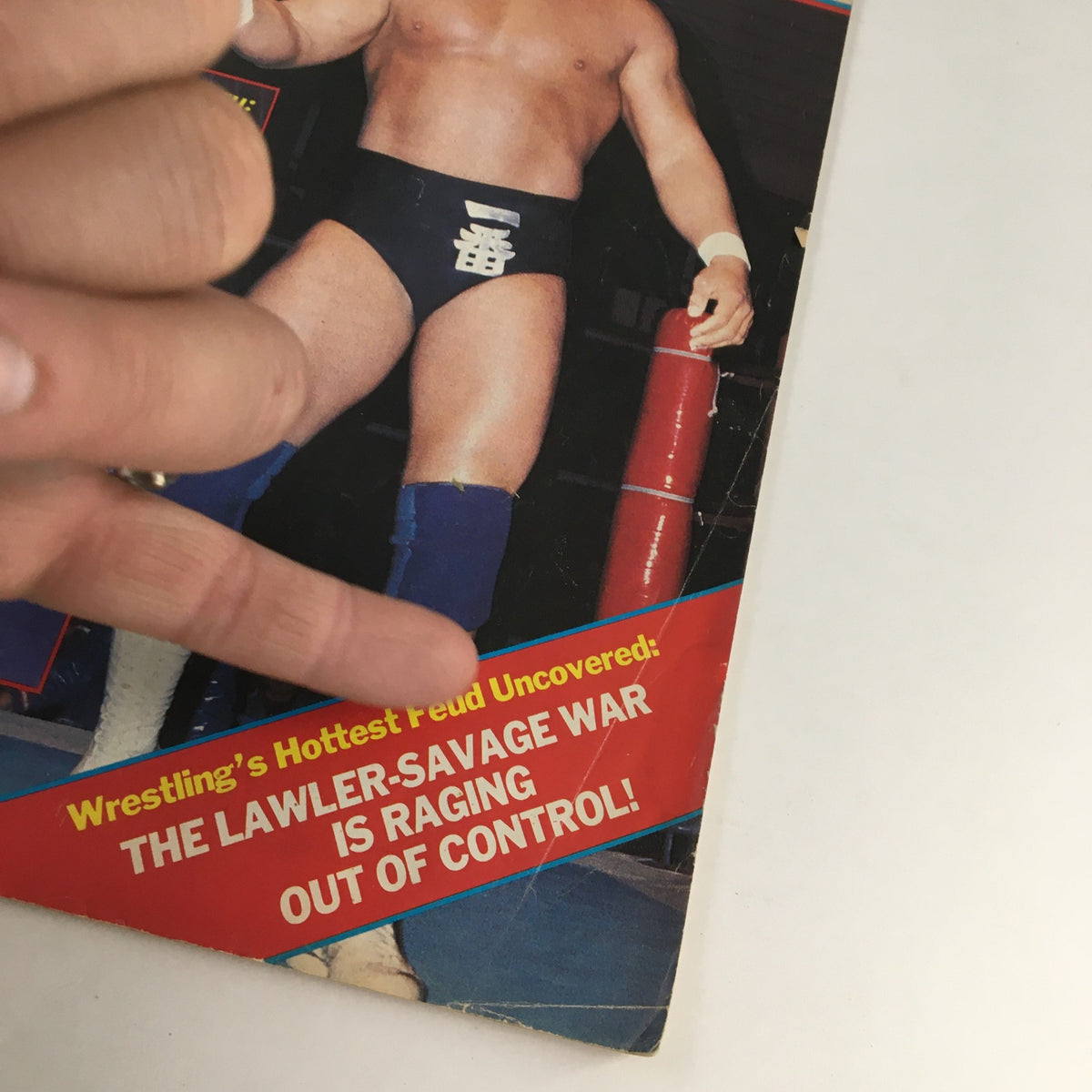 Close-up of The Wrestler Magazine September 1985 cover, emphasizing a dramatic headline about the Lawler-Savage wrestling feud alongside an image of Hulk Hogan in action.