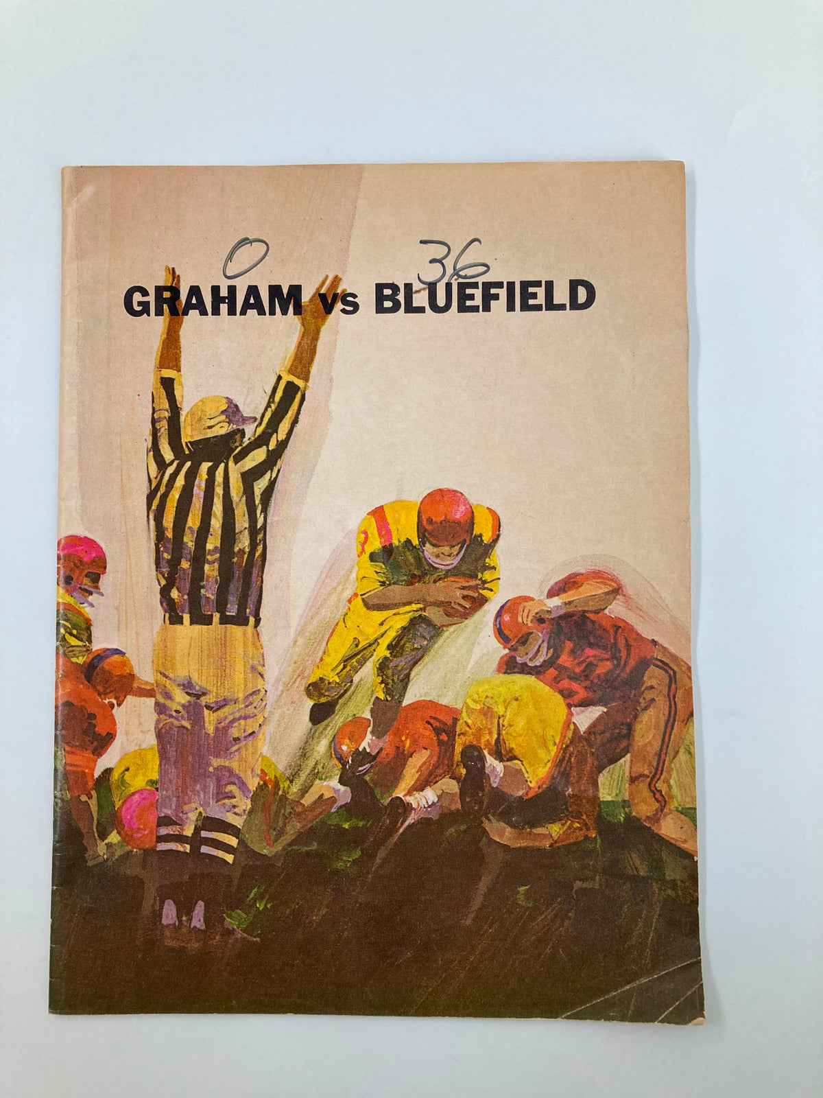 Cover of the 1949 High School Football Graham G-Men vs Bluefield Beavers Official Program featuring a referee signaling during the game.