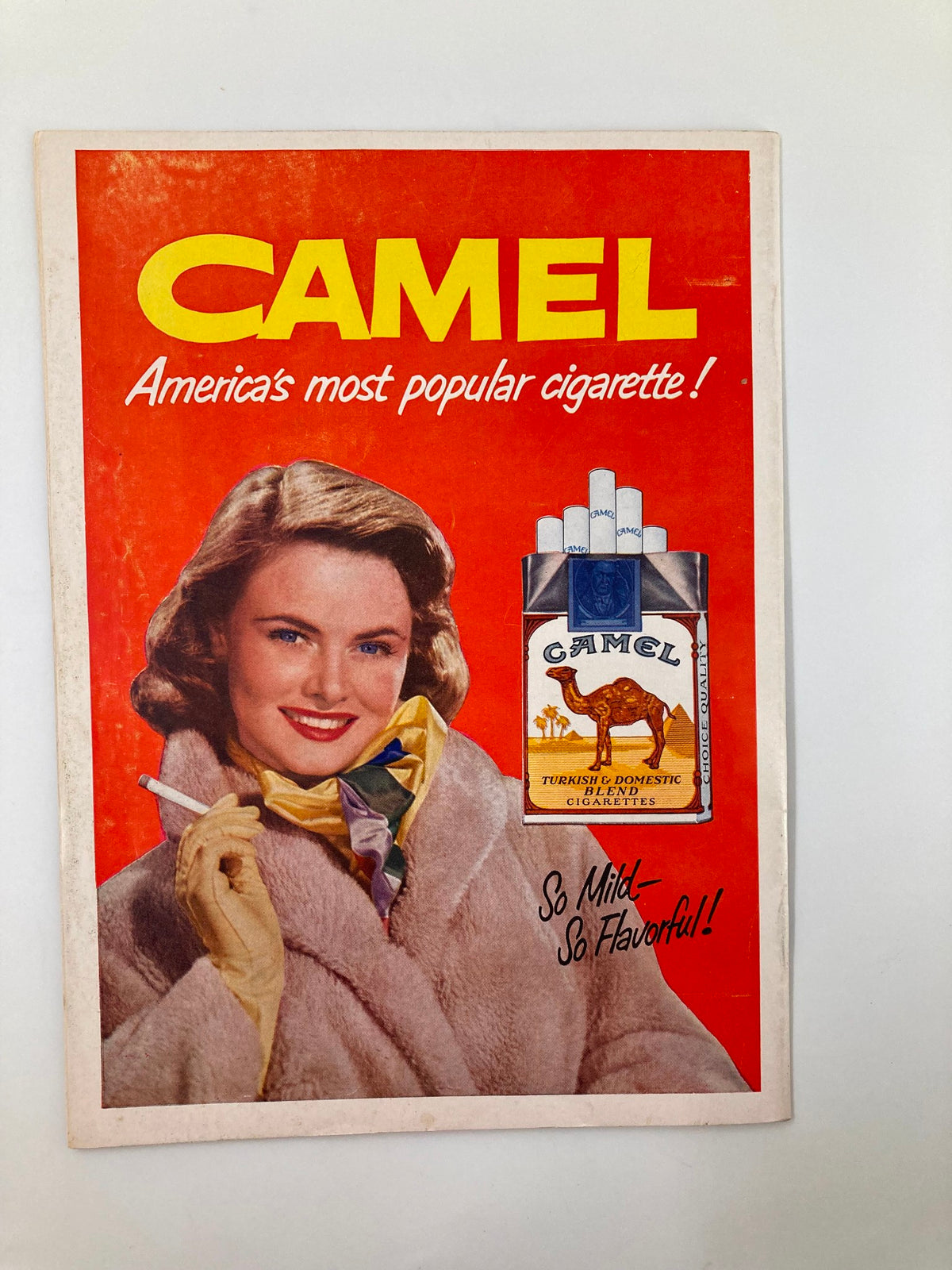 Vintage Camel cigarette advertisement from the era of the September 18, 1953 NCAA Football program, featuring a woman promoting Camel cigarettes.