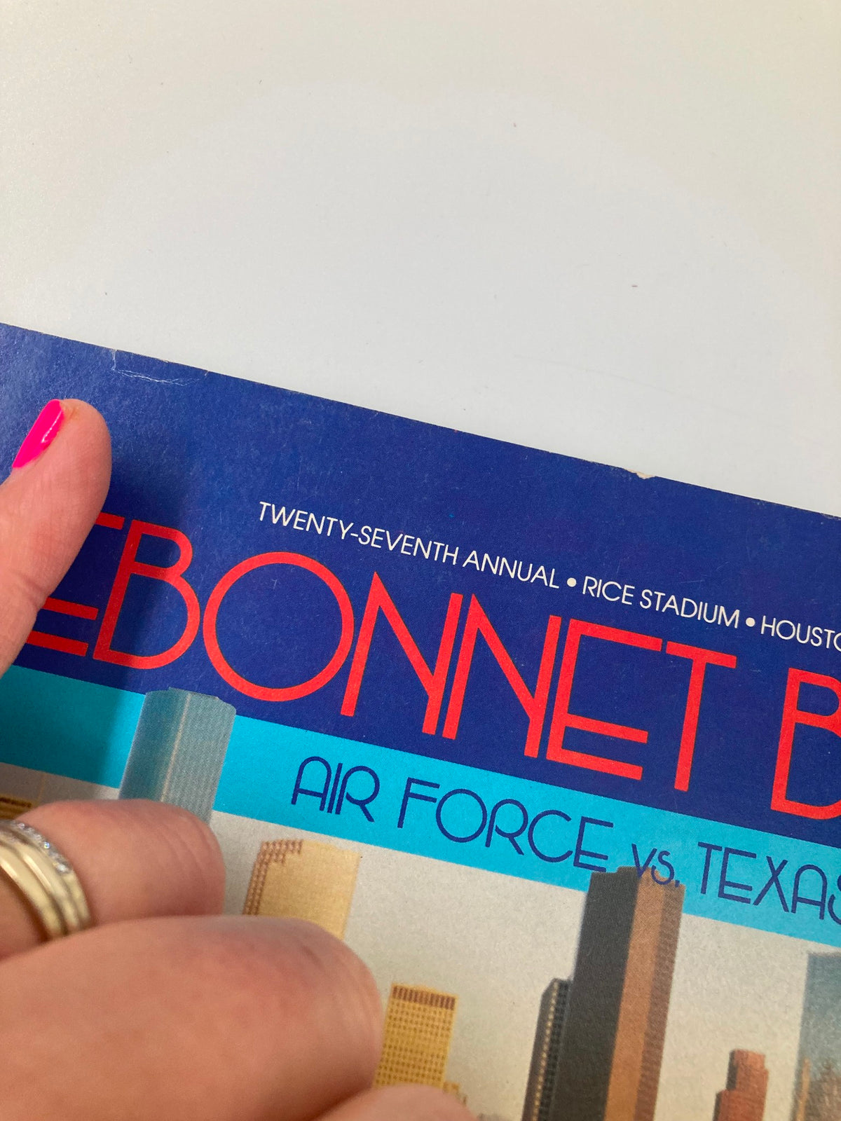 Close-up of the cover of the VTG December 31 1985 Bluebonnet Bowl Air Force vs Texas Official Program, highlighting the title and detail of the top edge.