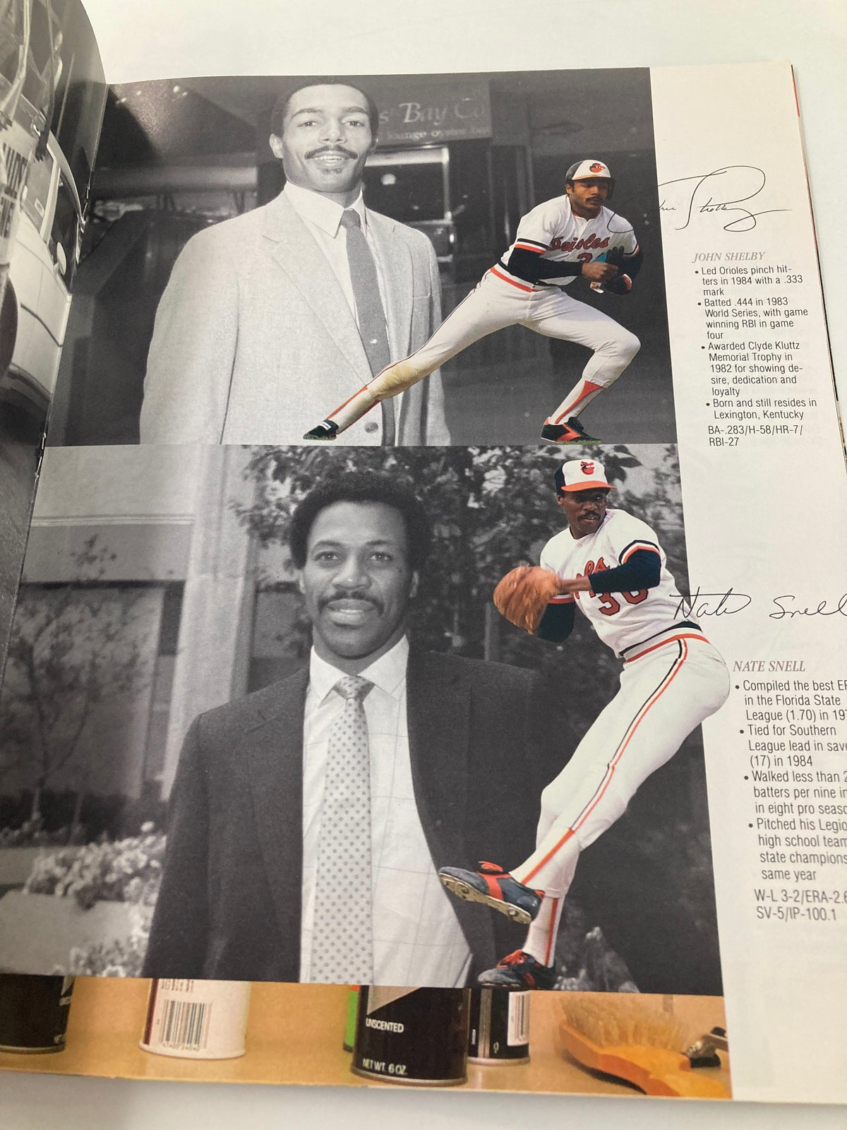 1966 Baltimore Orioles Yearbook featuring John Shelby in action with a photo of him in a suit, showcasing key players of the season.