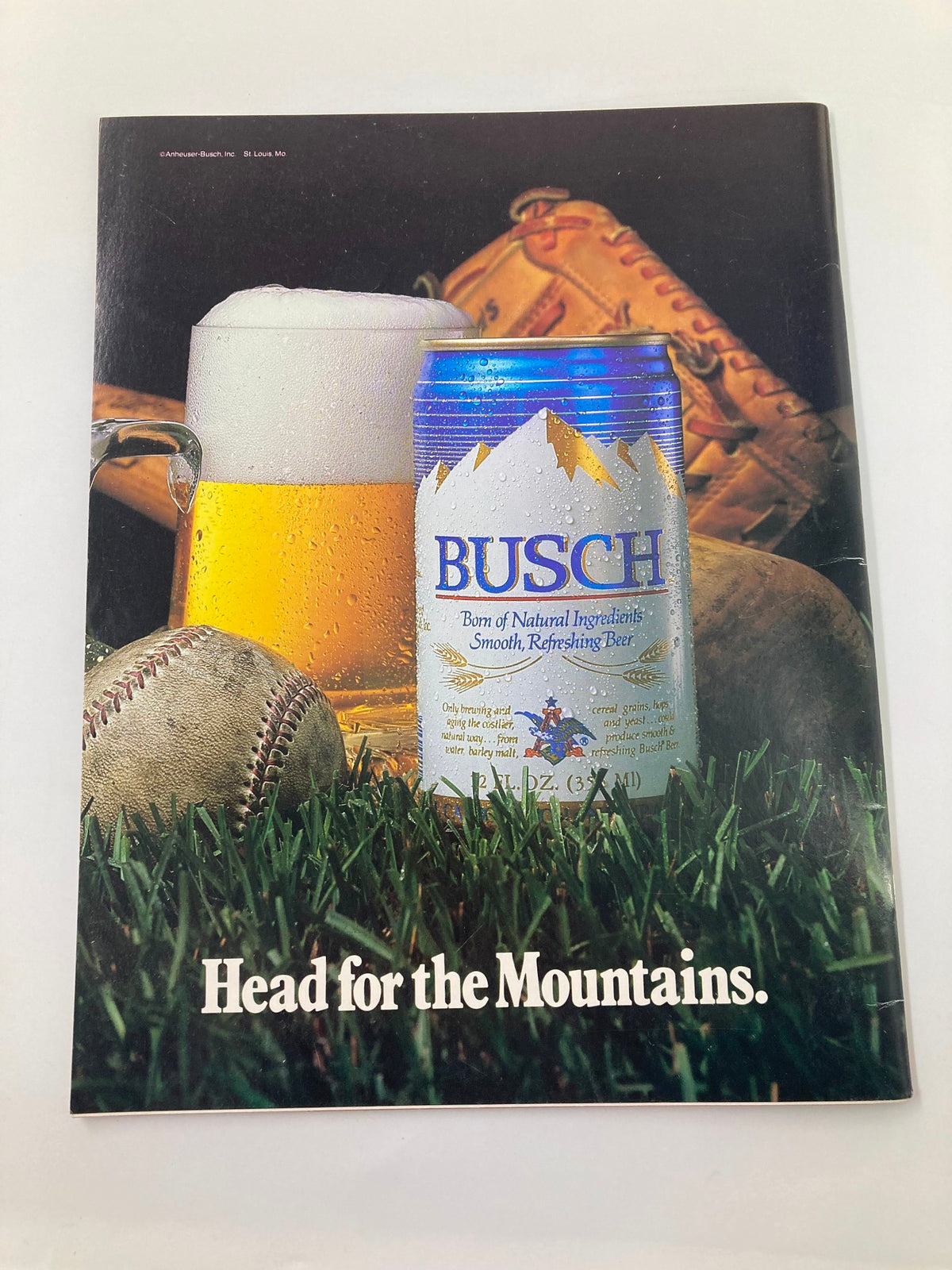 Cover image of the 1966 Baltimore Orioles Yearbook featuring a beer can and baseball glove, promoting the spirit of baseball culture.