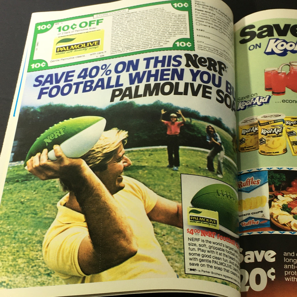 Retro advertisement promoting a discount on a Nerf football with Palmolive soap, showcasing a playful scene of outdoor fun, indicative of 1980's family-oriented marketing.