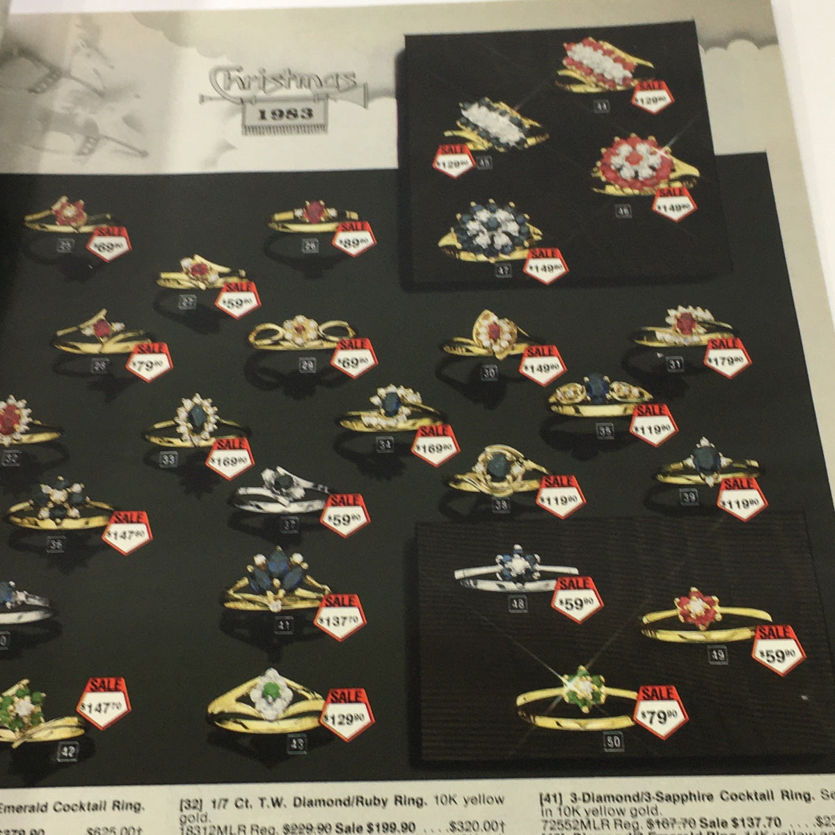 VTG Service Merchandise Showroom 1983 Christmas Sale Price Guide Catalog presenting a selection of gemstone rings, featuring sale prices and intricate designs.