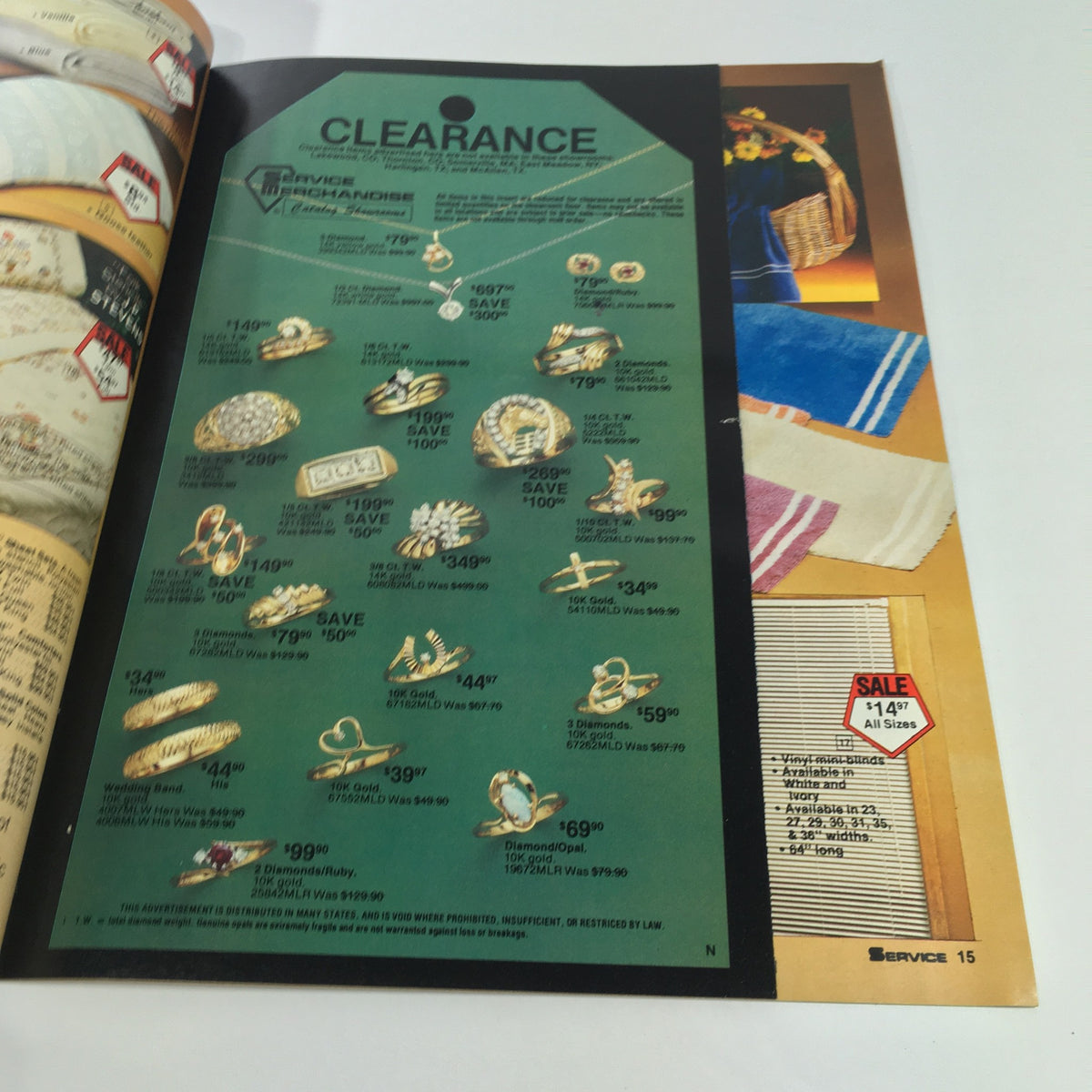 Vintage 1983 Service Merchandise Catalog showcasing gold and diamond jewelry clearance sale with prices displayed, capturing consumer culture of the early 80s.