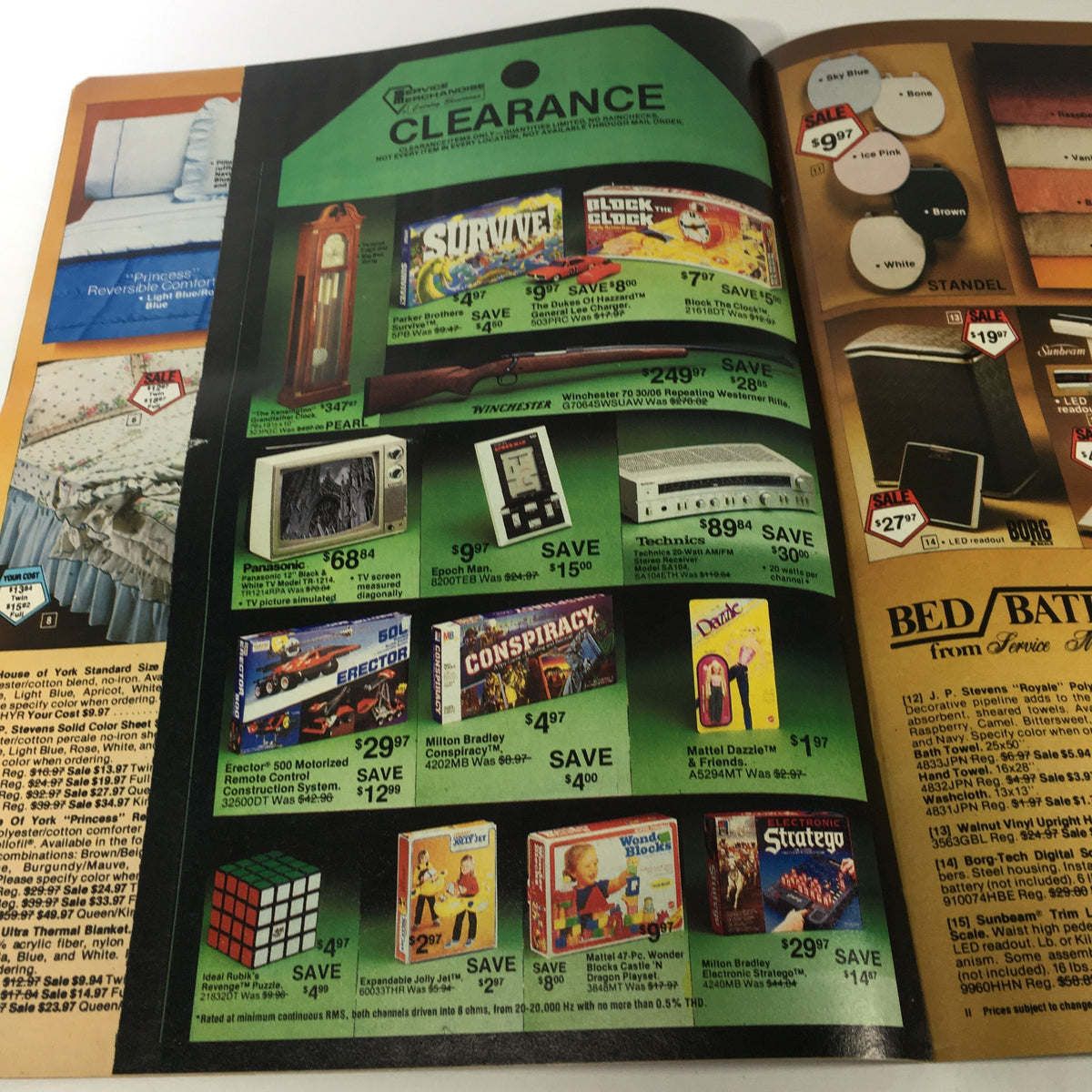 Vintage 1983 Service Merchandise Catalog featuring toy and electronic clearance sale items including games and gadgets, illustrating the popular trends of the era.