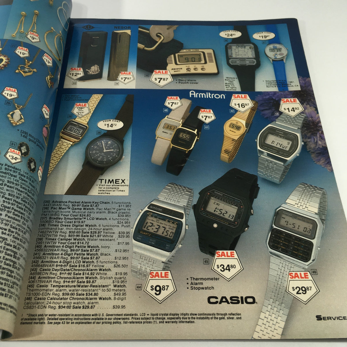 Inside page of the VTG 1983 Service Merchandise Catalog Showroom Summertime Savings Sale Guide displaying a variety of watches and accessories on sale, featuring brands like Timex and Armitron, along with sale prices.