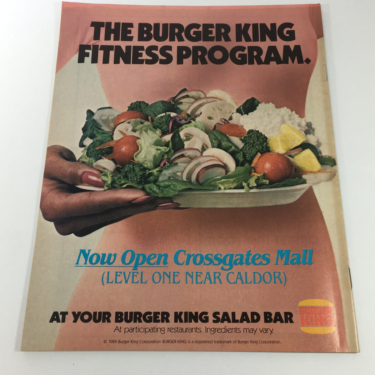 Advertisement from the VTG 1984 Fashion Crossgates Mall catalog promoting the Burger King Fitness Program featuring a vibrant salad dish.