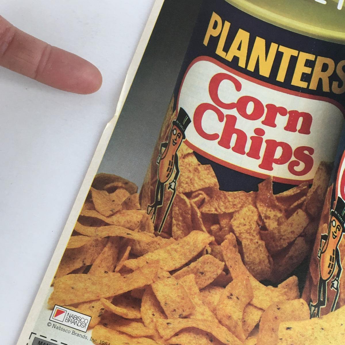 1984 Planters King Size Corn Chips Circular Coupon Advertisement close-up image of Planters Corn Chips can, highlighting the delicious chip texture and unique branding.
