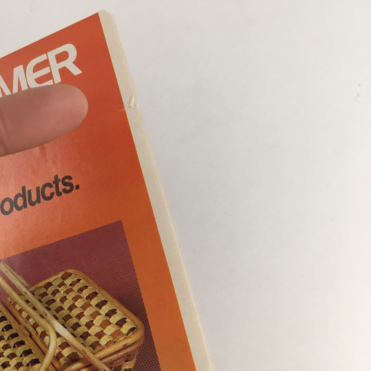 1984 Rattan Picnic Basket Circular Coupon Advertisement showcasing a rattan picnic basket against an orange background, highlighting promotional products features.