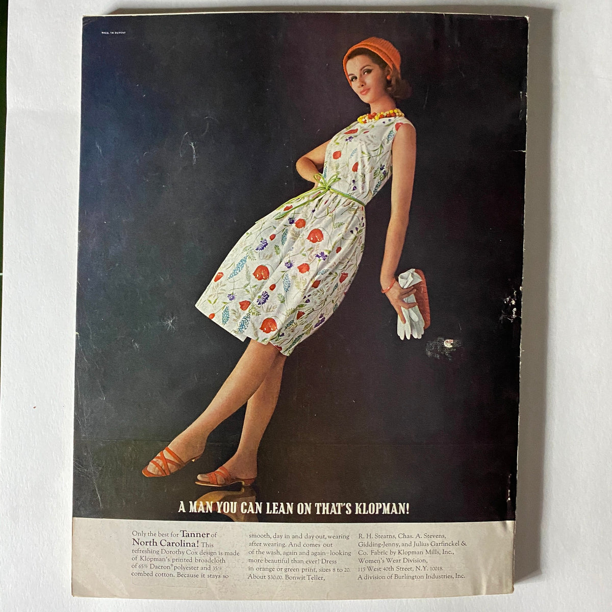 Vintage advertisement in the VTG Vogue Magazine April 1 1965, featuring a model in a floral dress and accessories.