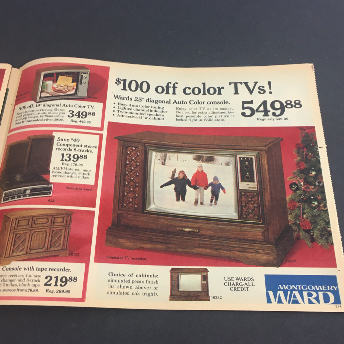 VTG November 27 1977 Montgomery Ward Holiday Value Sale Circular advertising a discount on color TVs, showcasing a family watching TV in a snowy scene.
