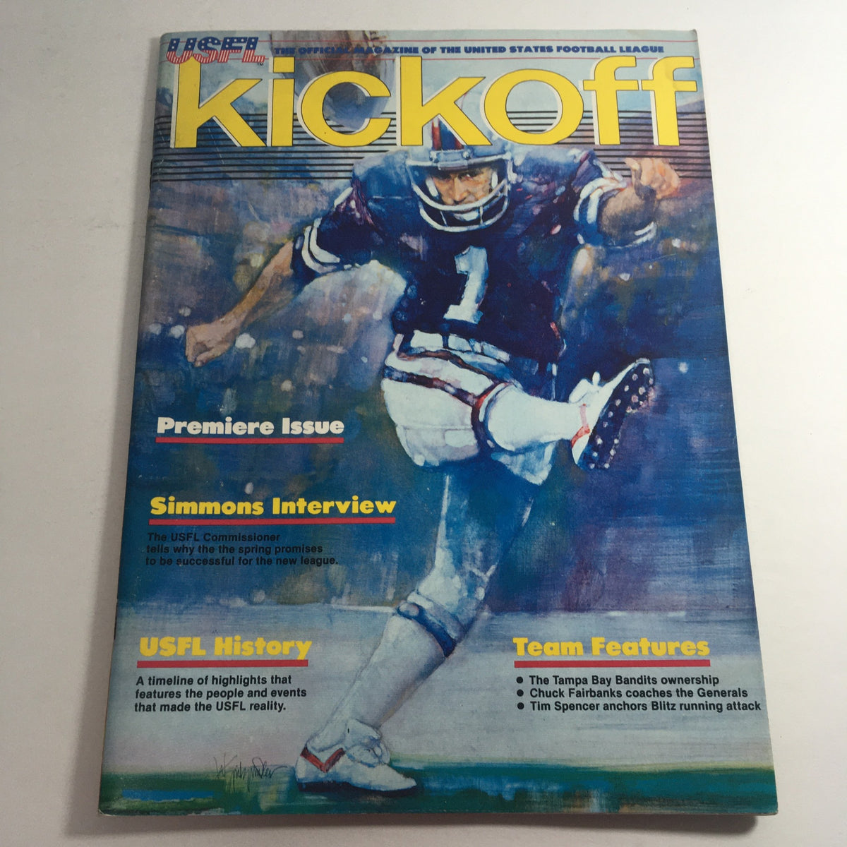 Cover of the USFL Kickoff Official Magazine 1983 showcasing the premiere issue with athlete in action, featuring an interview with Chet Simmons and highlights of USFL history.
