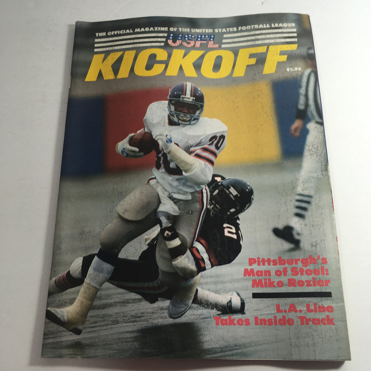 VTG USFL Kickoff Official Magazine 1984 Vol. 2 #5 featuring an action shot of a player being tackled, highlighting the excitement of the USFL.