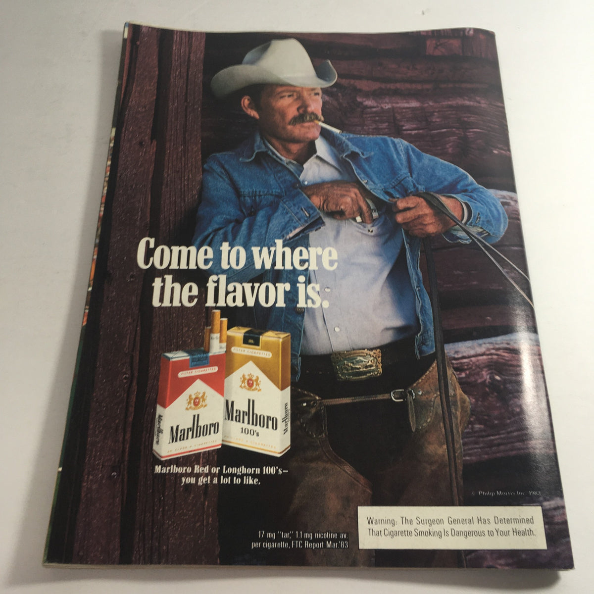 Back cover of the VTG USFL Kickoff Official Magazine 1984 Vol. 2 #5, featuring a vintage Marlboro advertisement with a cowboy promoting cigarettes.