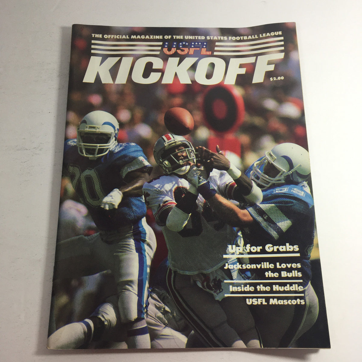 VTG USFL Kickoff Official Magazine 1985 Vol 3 #4 cover featuring players in action with the headline 'Up for Grabs' and promotional content about USFL mascots.