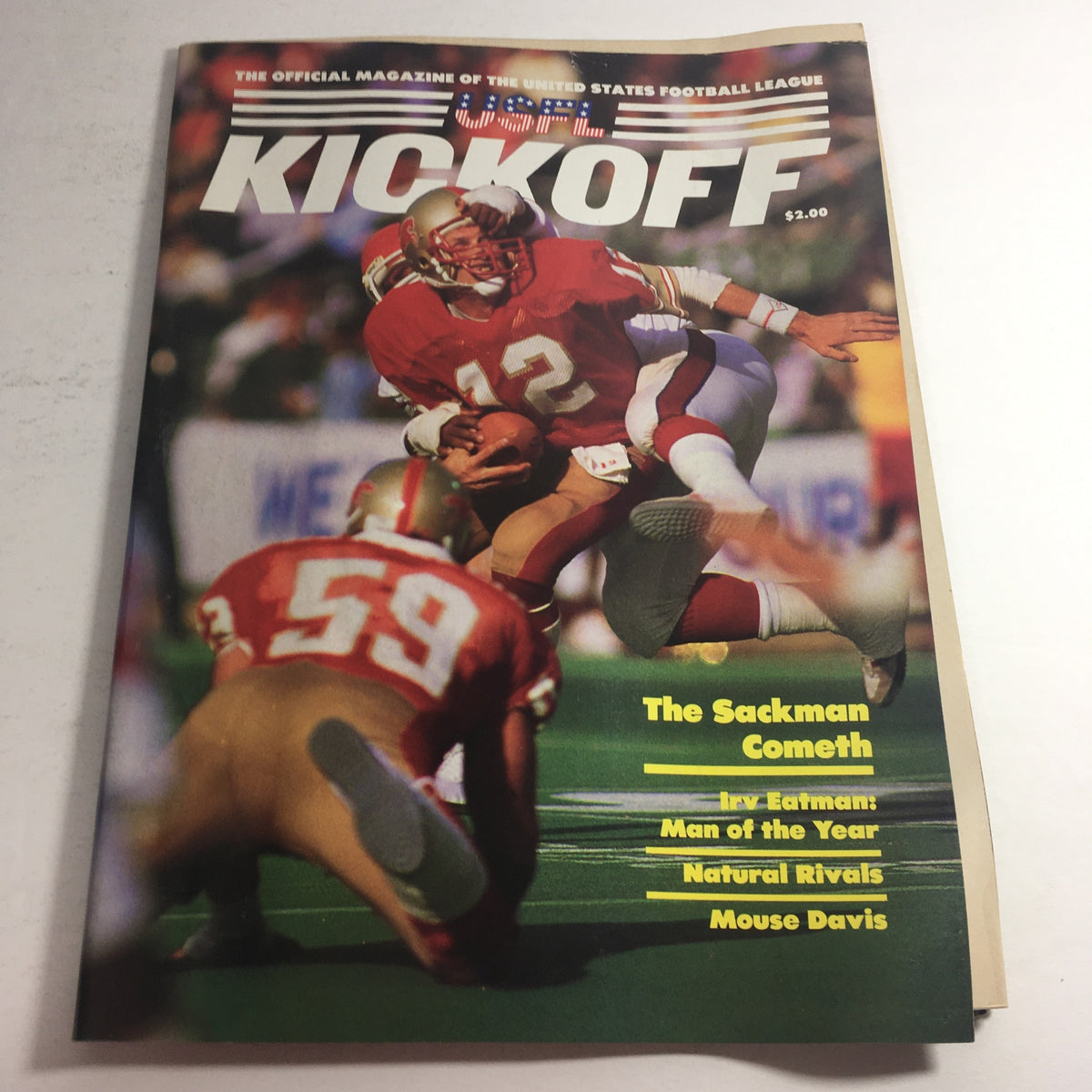 Cover of the VTG USFL Kickoff Official Magazine 1985 showcasing Irv Eatman and Mouse Davis, featuring football action and bold titles.