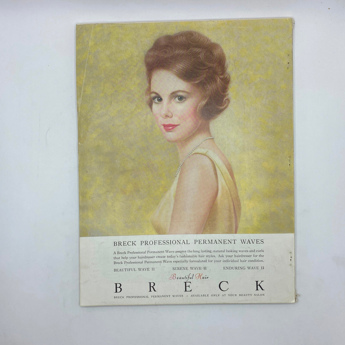 Cover image of the Breck Professional Permanent Waves advertisement featuring a woman with a classic hairstyle, promoting hair styling products, showcasing vintage beauty trends.