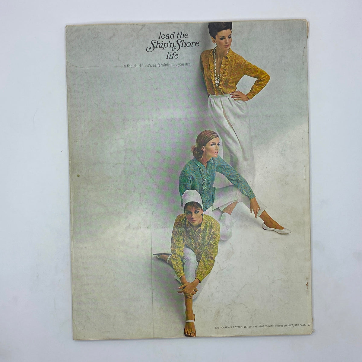 Back cover of vintage Vogue Magazine January 1, 1964 featuring models in stylish outfits promoting fashion trends of the 1960s.