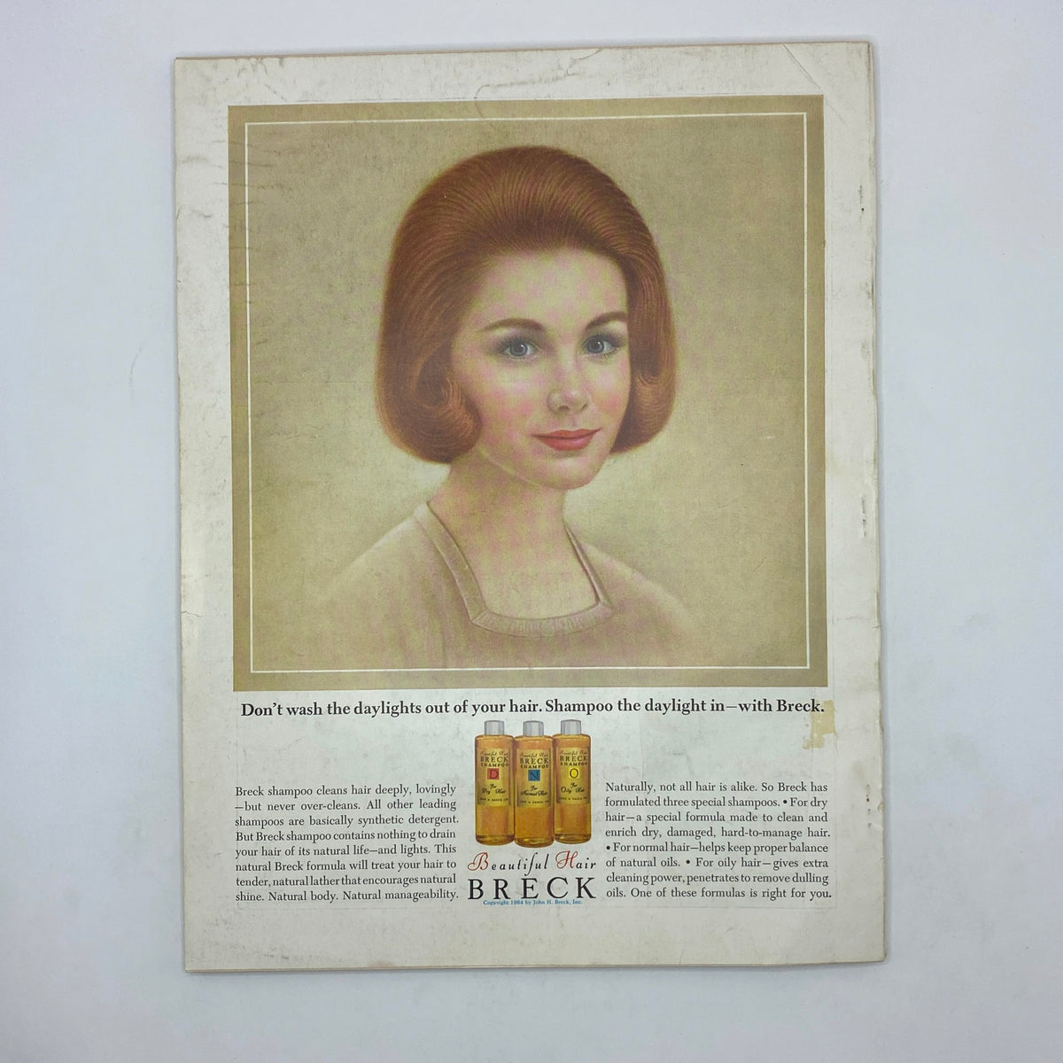 Advertisement for Breck shampoo in VTG Vogue Magazine August 15 1964, featuring a vintage illustration of a woman with styled hair.