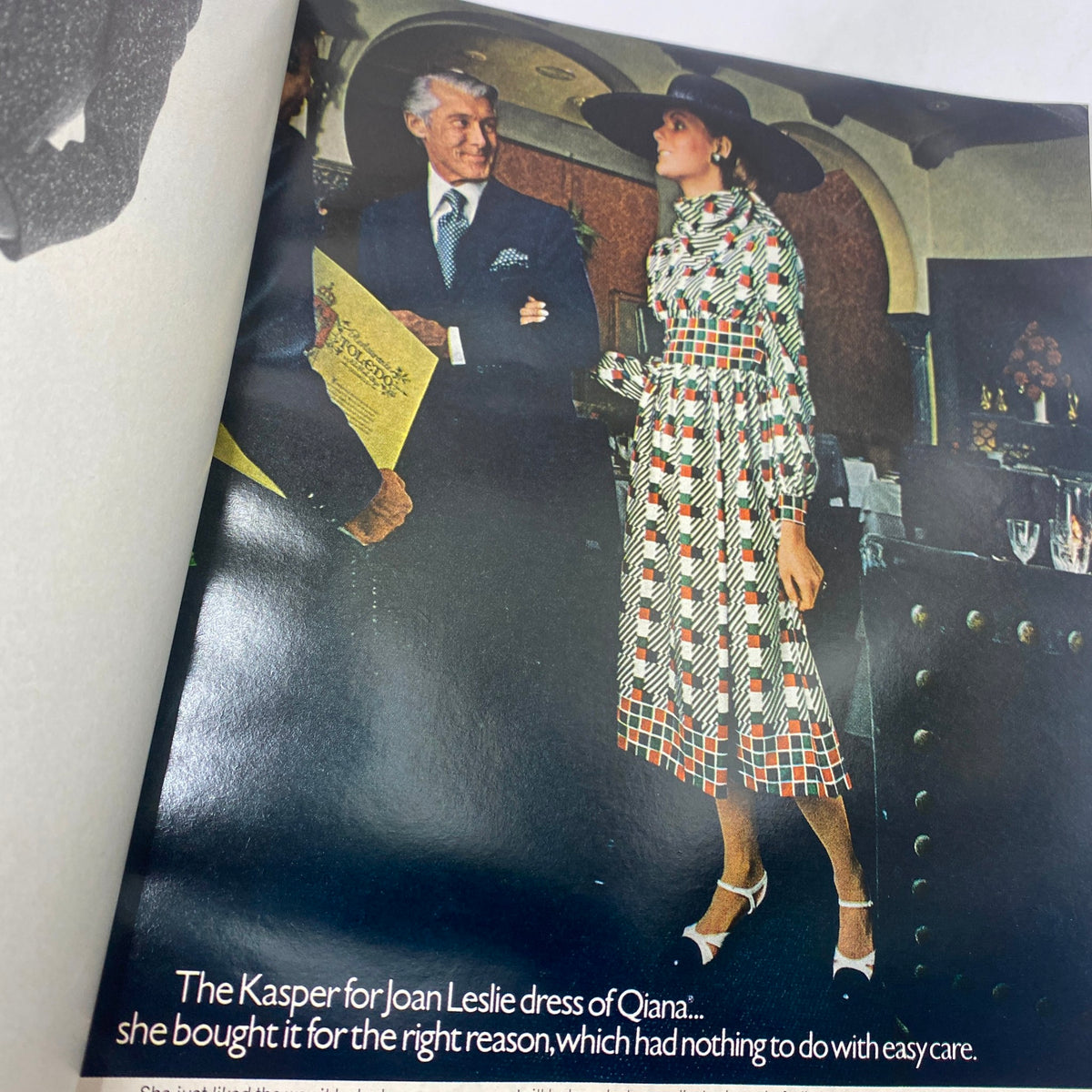Fashion spread in VTG Vogue Magazine February 1 1971, highlighting a model in a chic patterned dress with elegant accessories.
