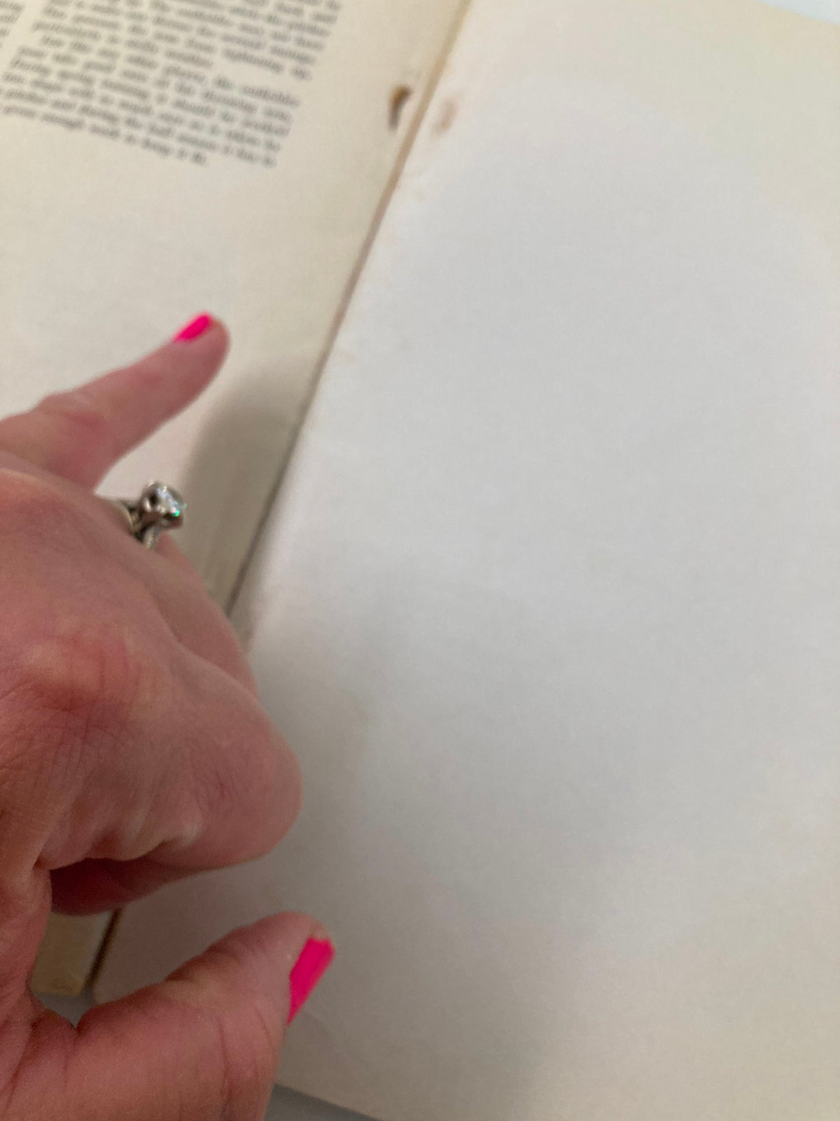 Inside view of the September 30 1956 How To Play Championship Baseball program, depicting a hand pointing at a blank page.